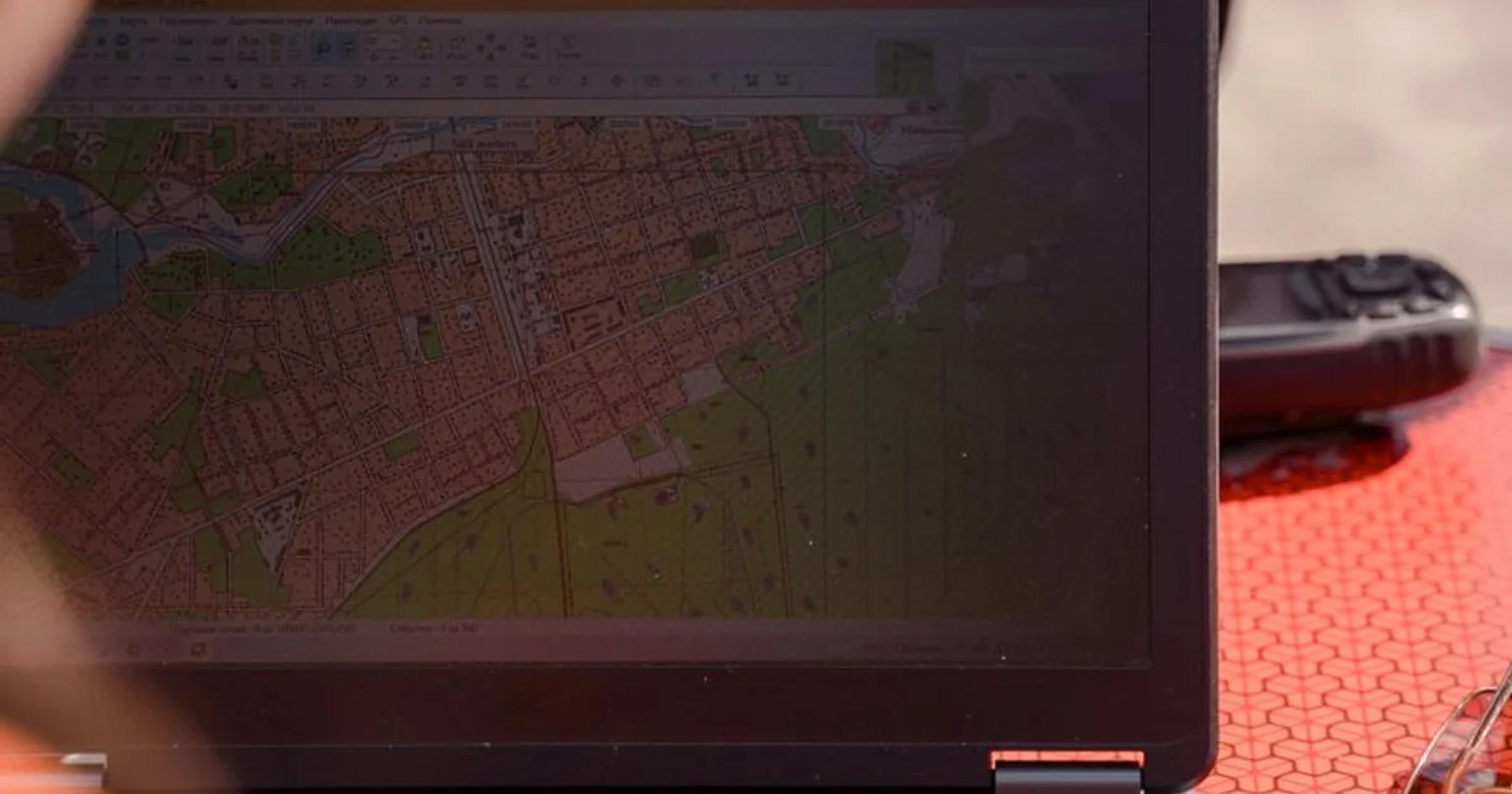 A person using assistive technology to navigate a digital civic map for ADA compliance