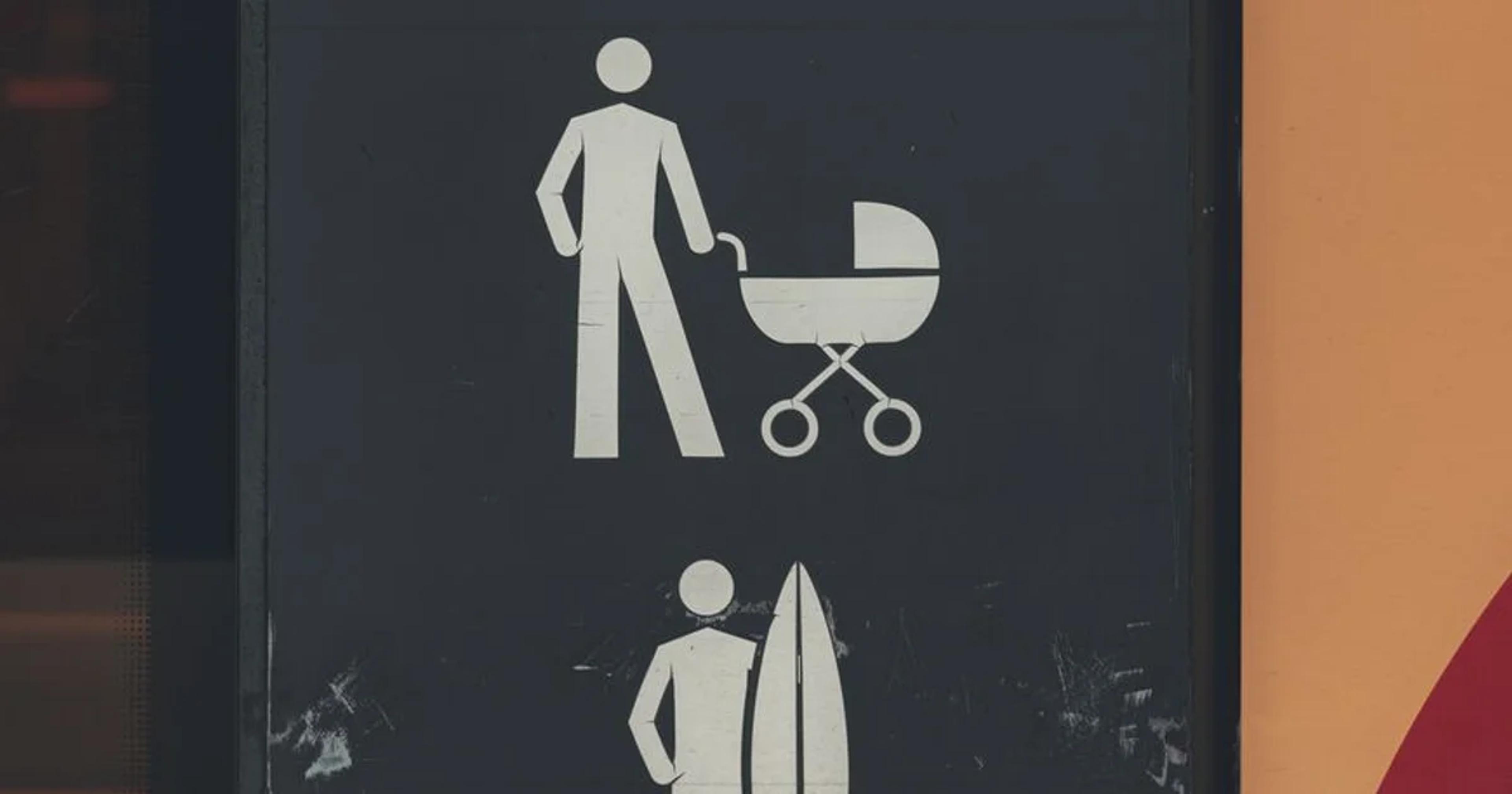 Modern digital signage display featuring ADA compliance icons in a public lobby