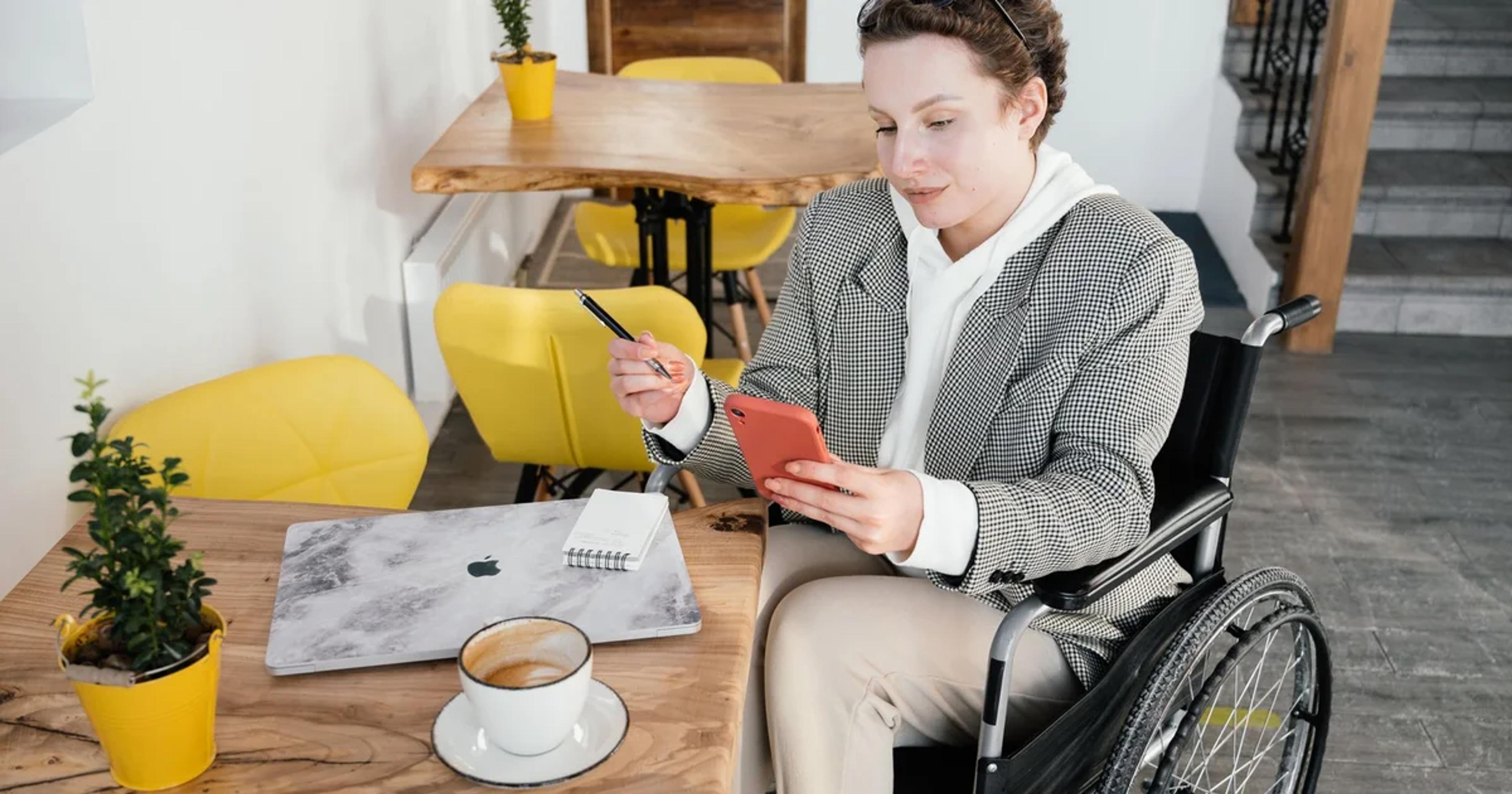 A person using assistive technology to view a digital ADA compliance dashboard
