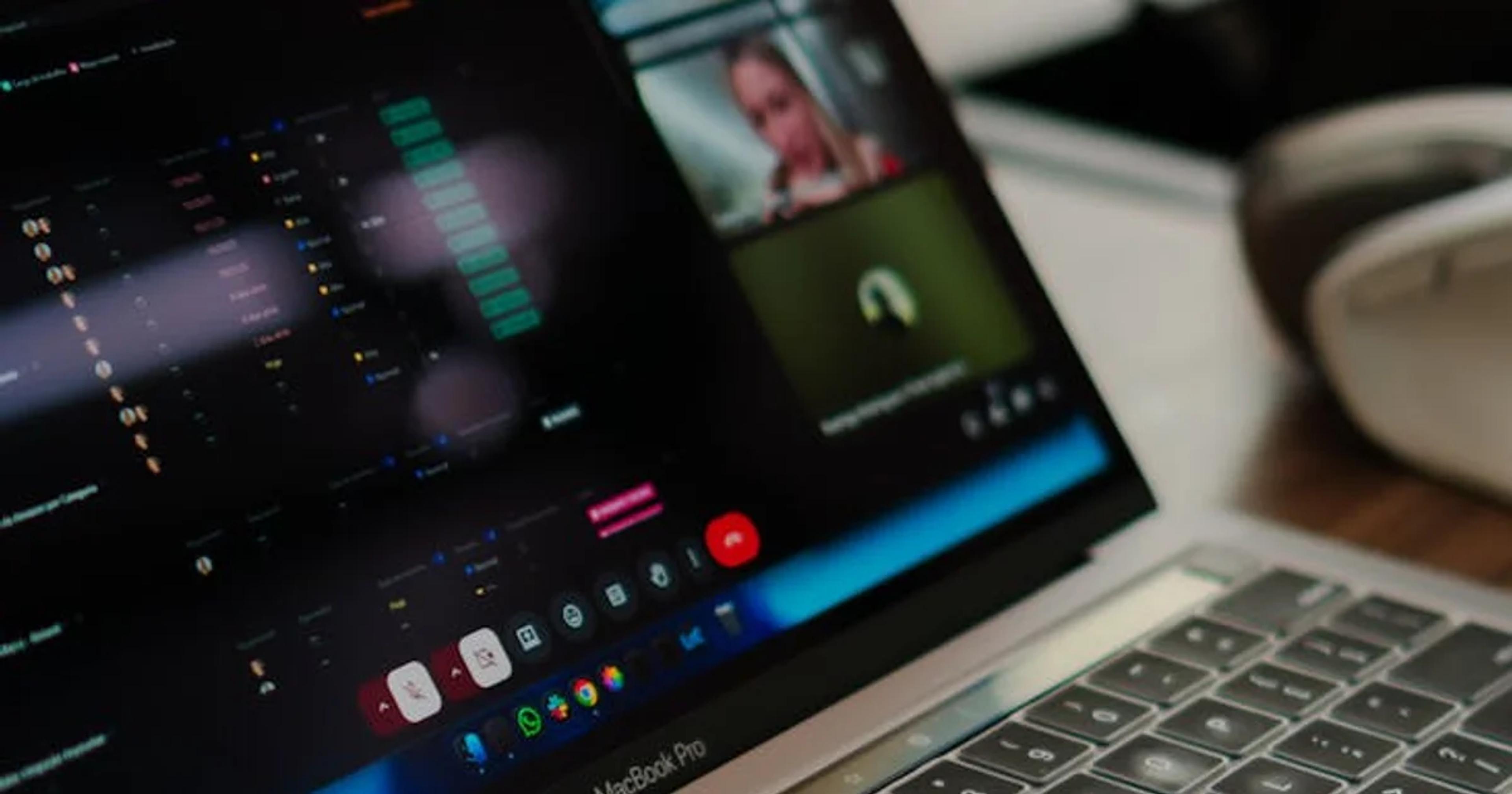 Diverse team discussing digital GovTech accessibility on a laptop in a modern office.