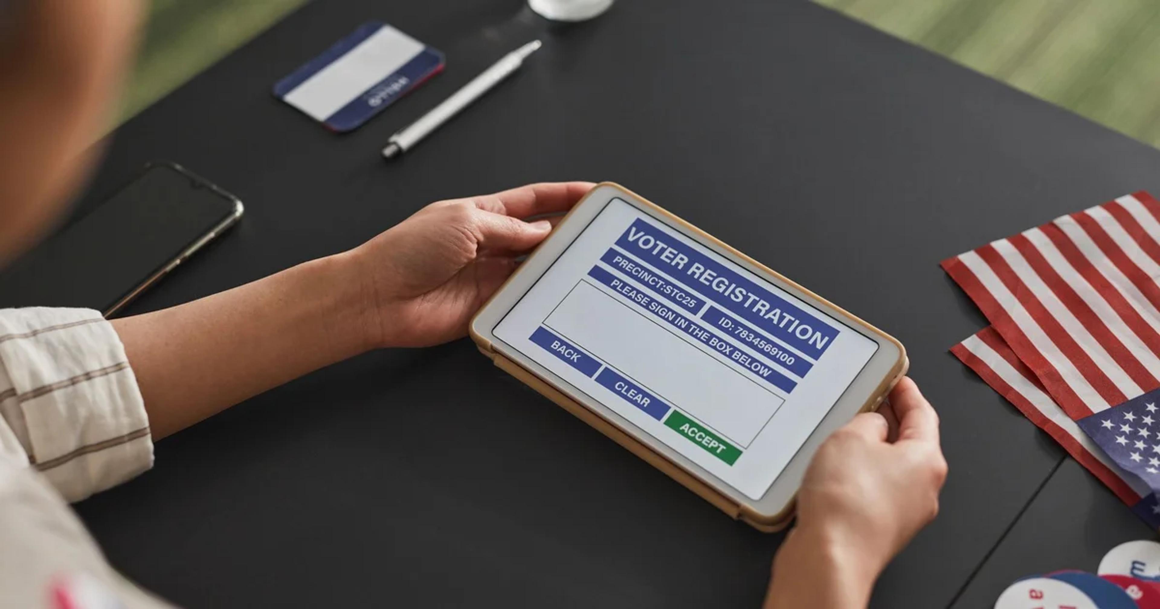 Local government official helps citizen access digital services, showcasing sustainable accessibility for small governments.