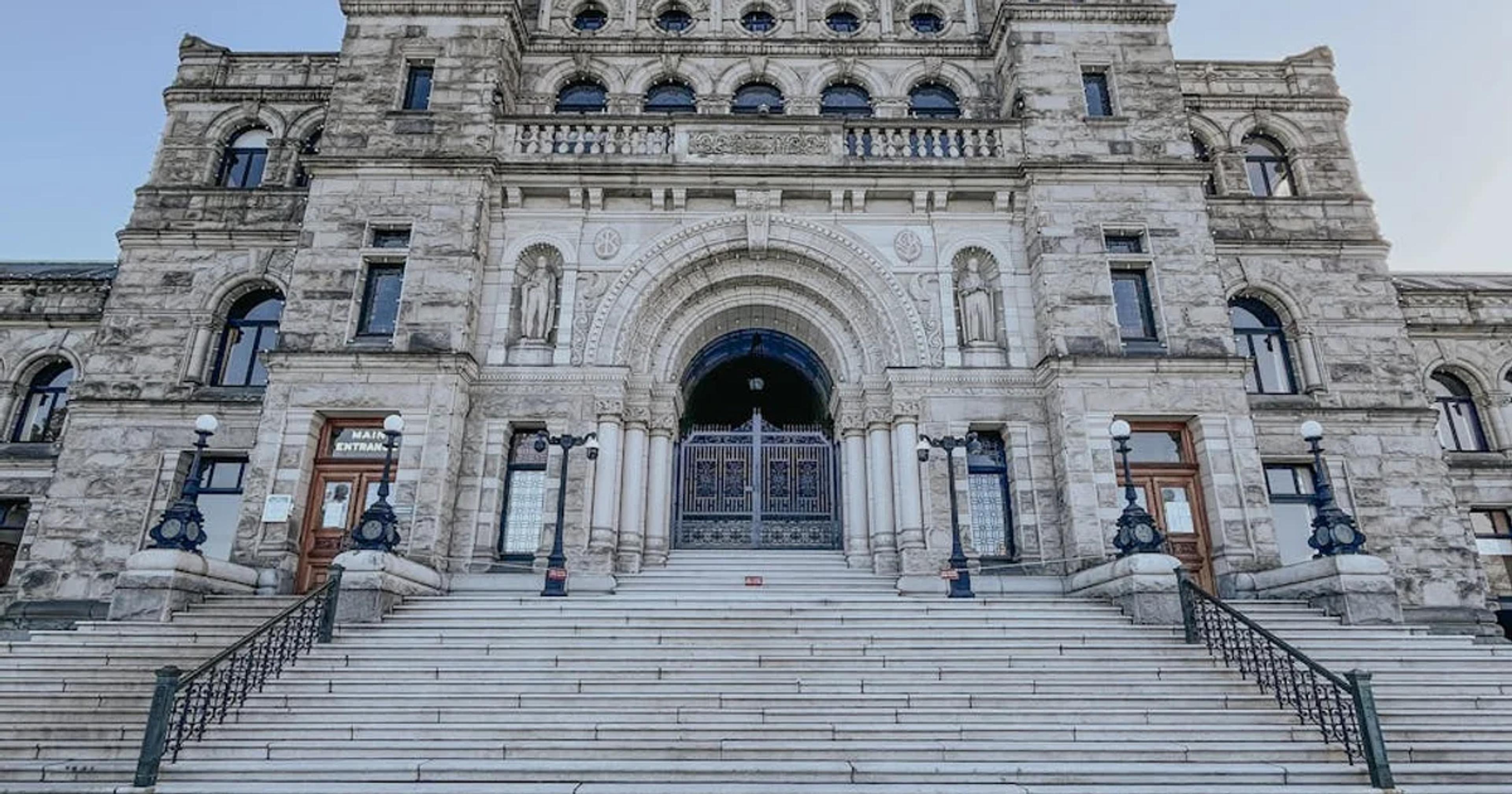 Government building with digital accessibility icons, ensuring GovTech is inclusive.
