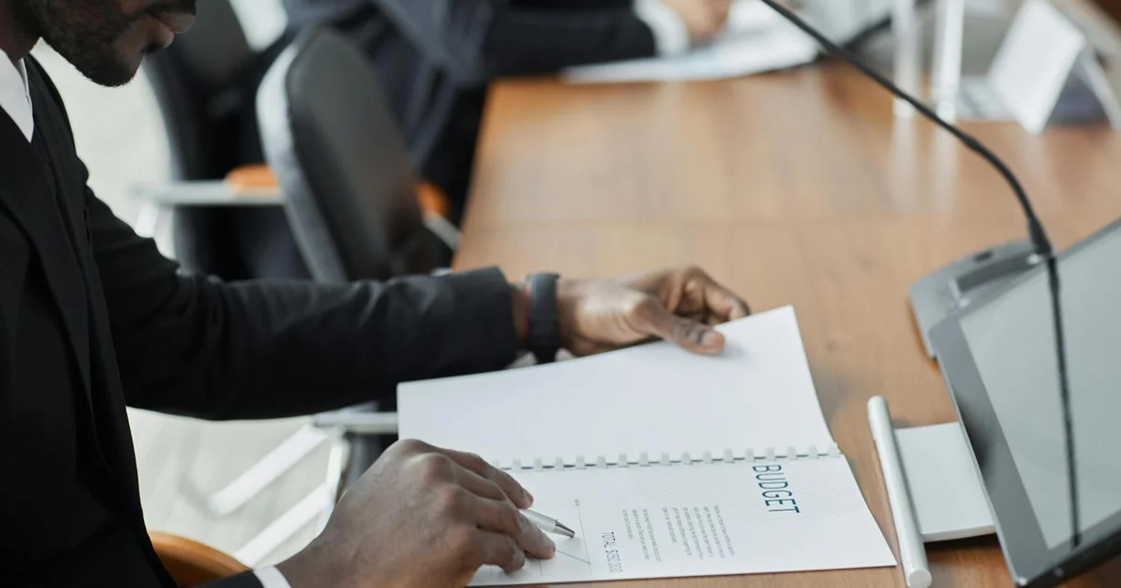 Business leaders discussing regulatory flexibility to optimize budgets and ensure compliance in a B2B setting.