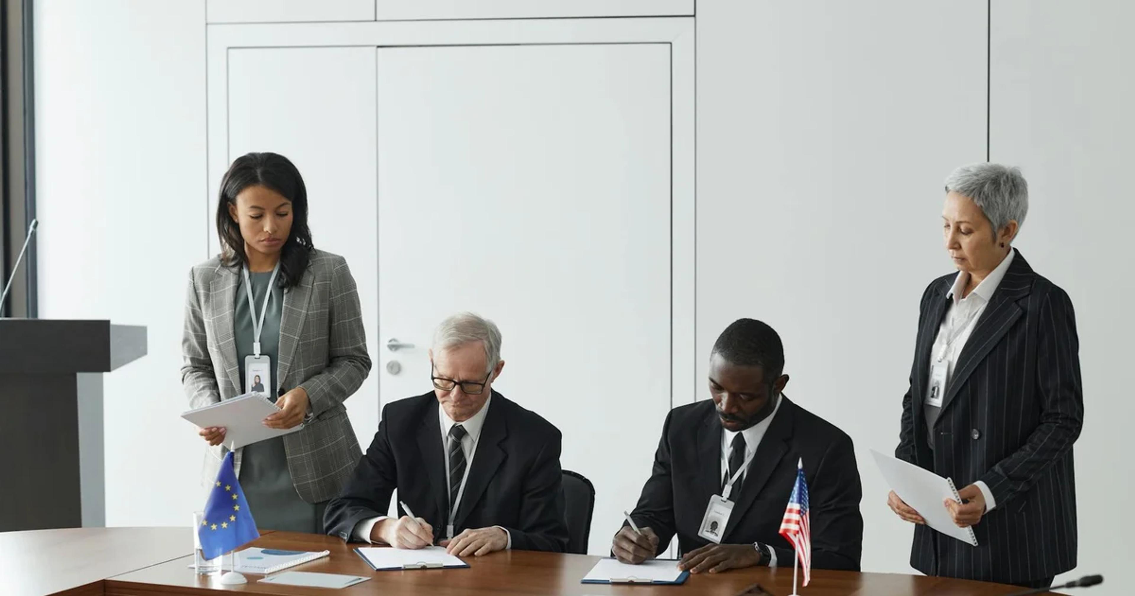 Government officials and tech professionals collaborating on accessible digital service interfaces, showcasing inclusive design principles and technology integration.