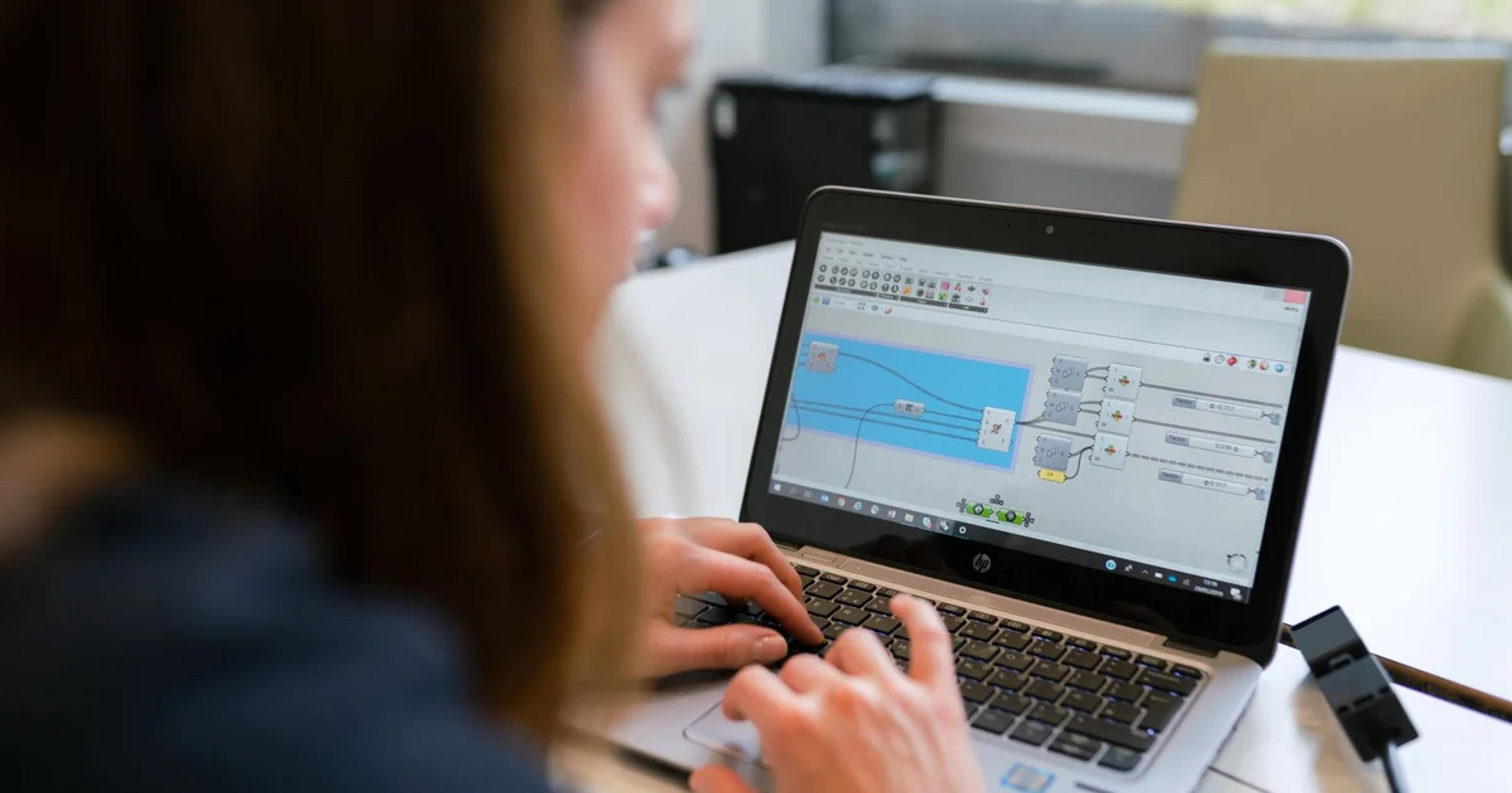 Professional reviewing accessible digital procurement documents on a laptop