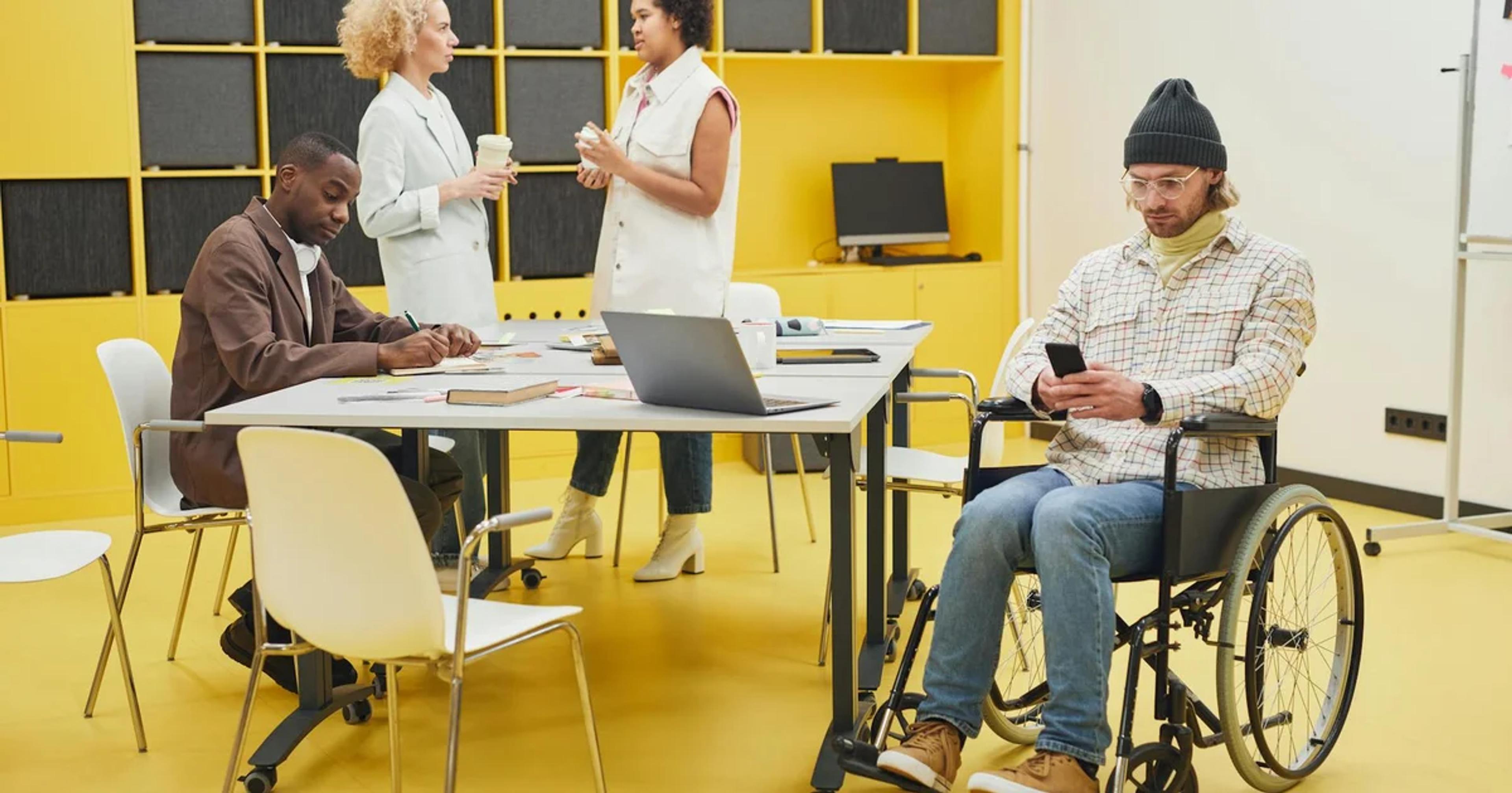 Diverse group of people using various digital devices, showcasing inclusive digital user experience for all citizens.