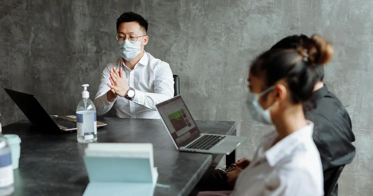 Business professionals collaborating to strategize on adapting compliance to evolving regulatory deadlines.