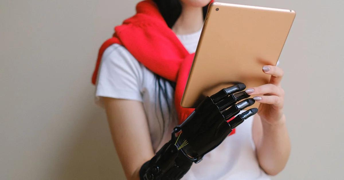 A person using an accessible civic telehealth portal on a laptop with assistive technology