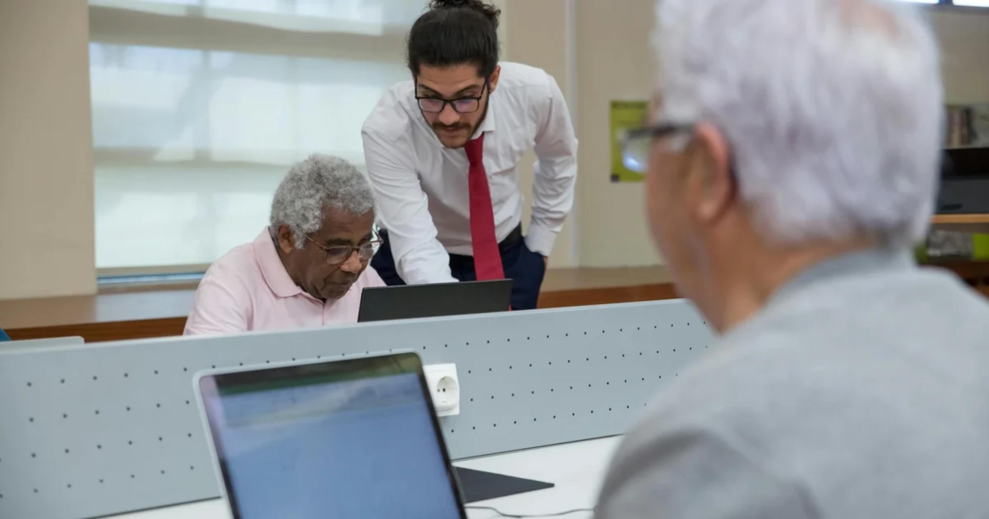Diverse group of seniors using digital devices for ADA compliance and web accessibility