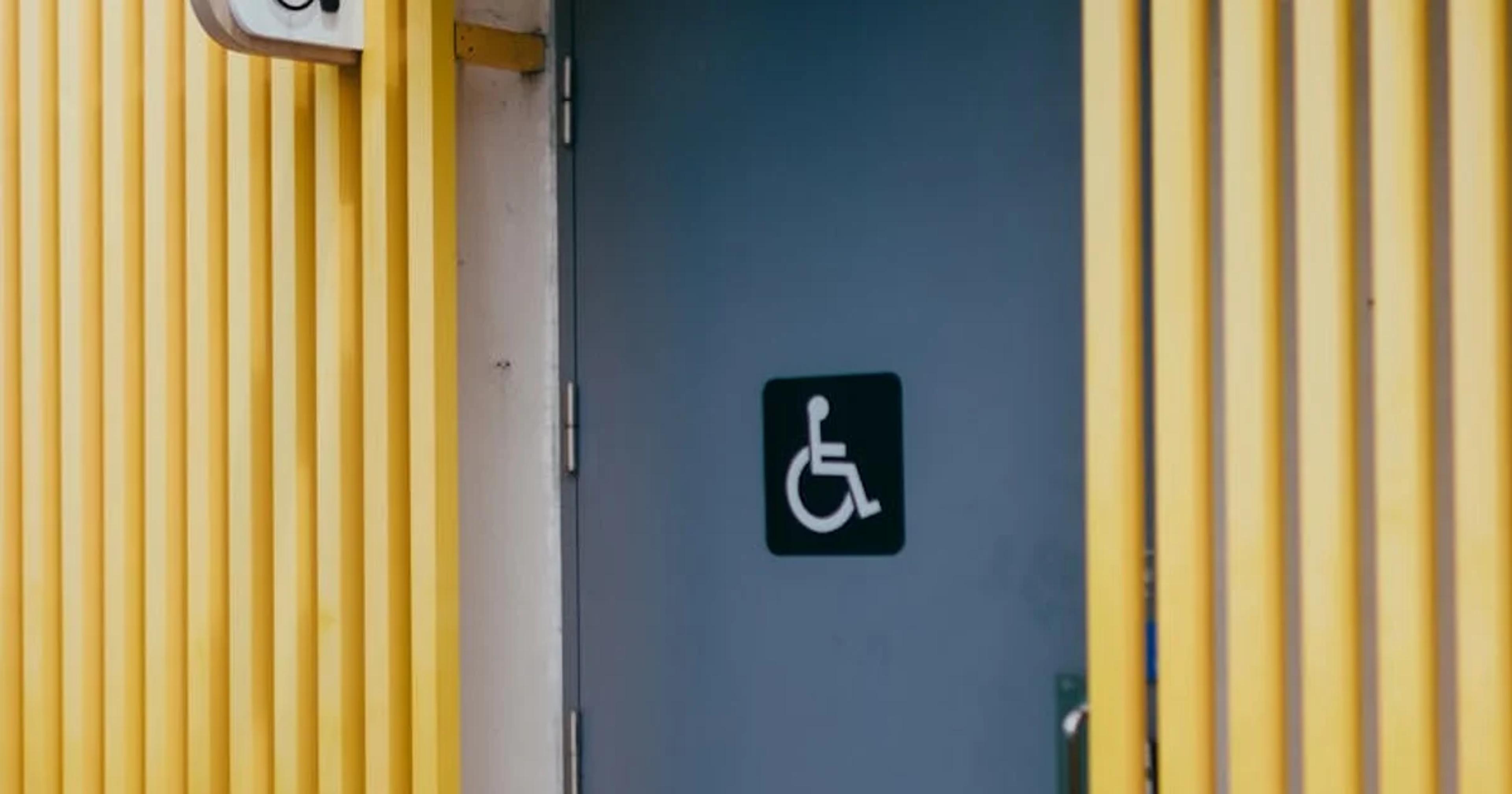 Government building entrance with ramp, symbolizing ADA accessibility statement compliance.