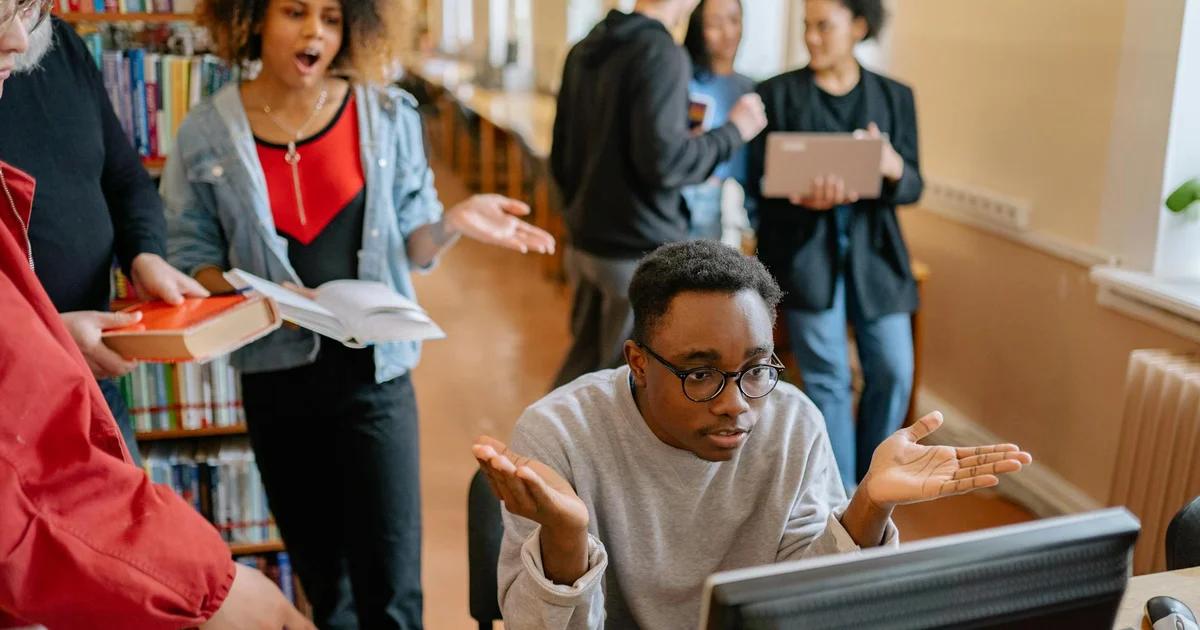 Diverse student journalists ensuring their digital publications meet Student Press ADA Compliance standards.