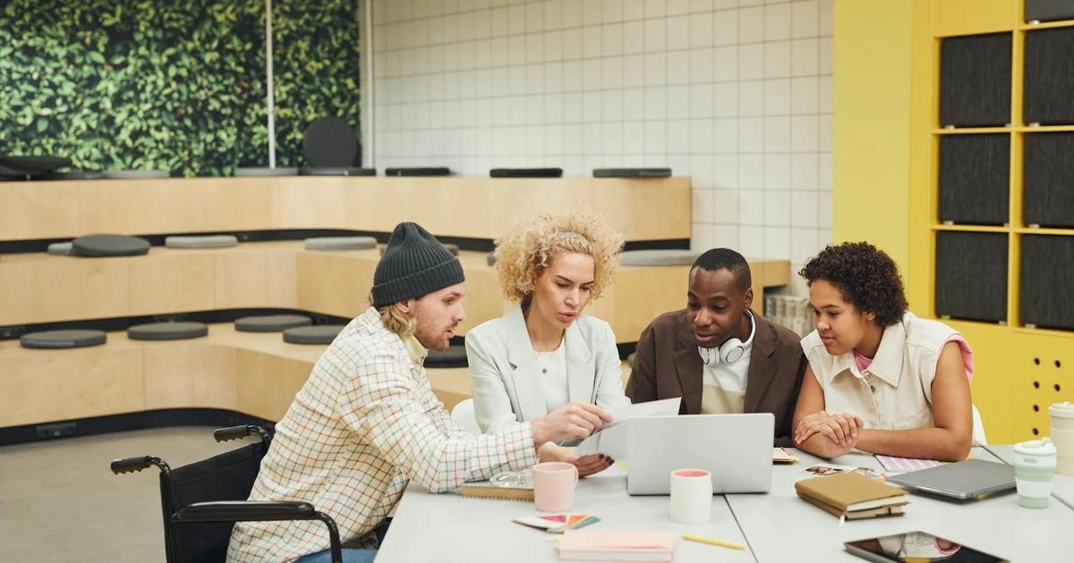 A diverse team collaborating on content creation strategy, ensuring web accessibility and compliance standards.