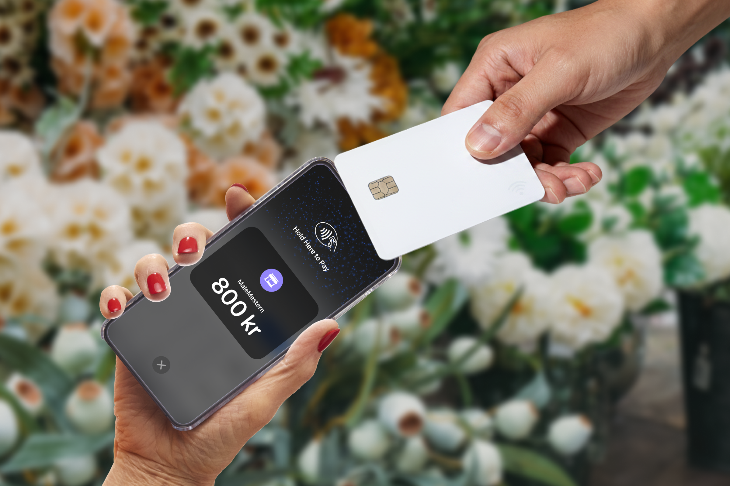 A hand taps a payment card to an iPhone displaying 800 kr for contactless payment in a flower shop.