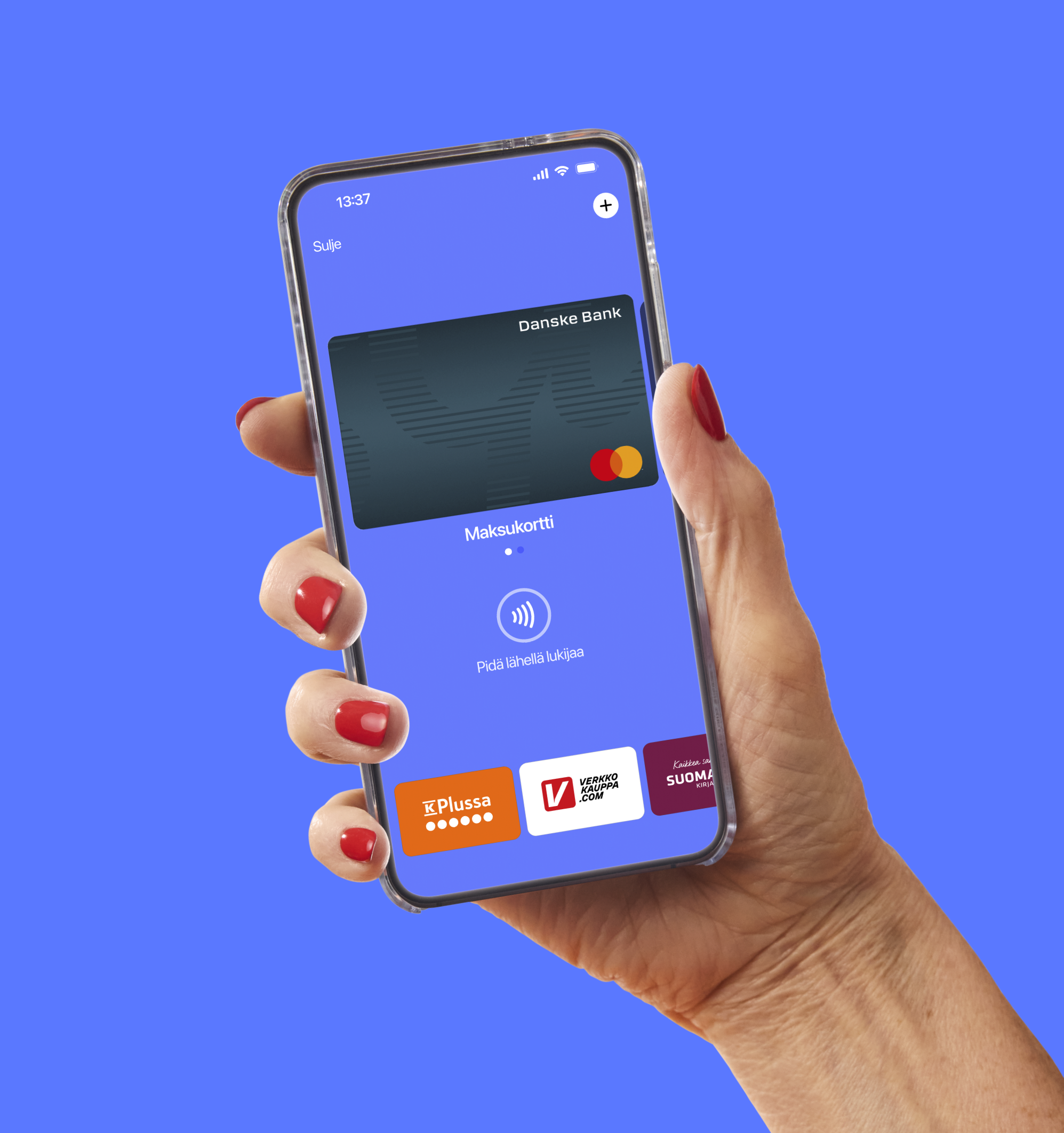 A hand with red nails holds a smartphone displaying a mobile payment app with a Danske Bank card and contactless payment symbol.