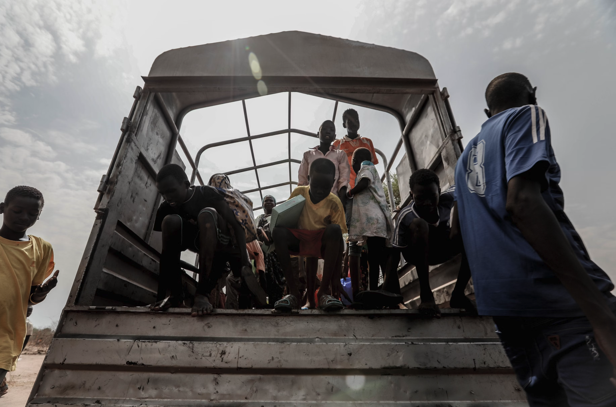 An image of kids getting off of a truck