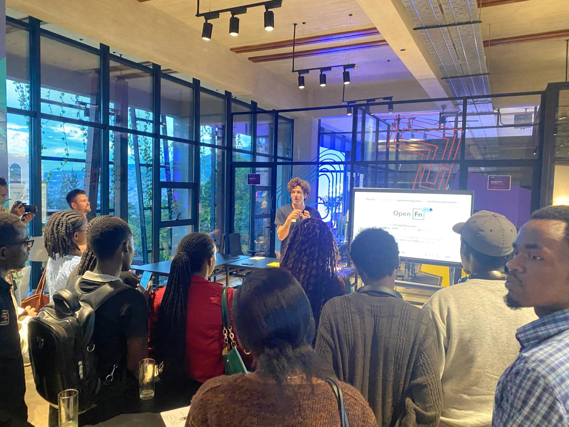 Taylor speaking to the guests about OpenFn and the exciting things to come