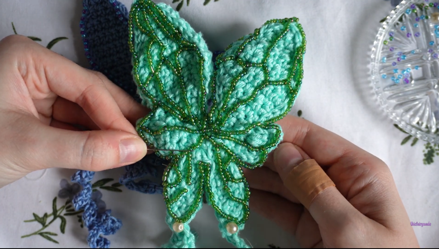 Visual guide of the beading section. Vein-like lines separate each section of the wings to create a dragonfly effect.