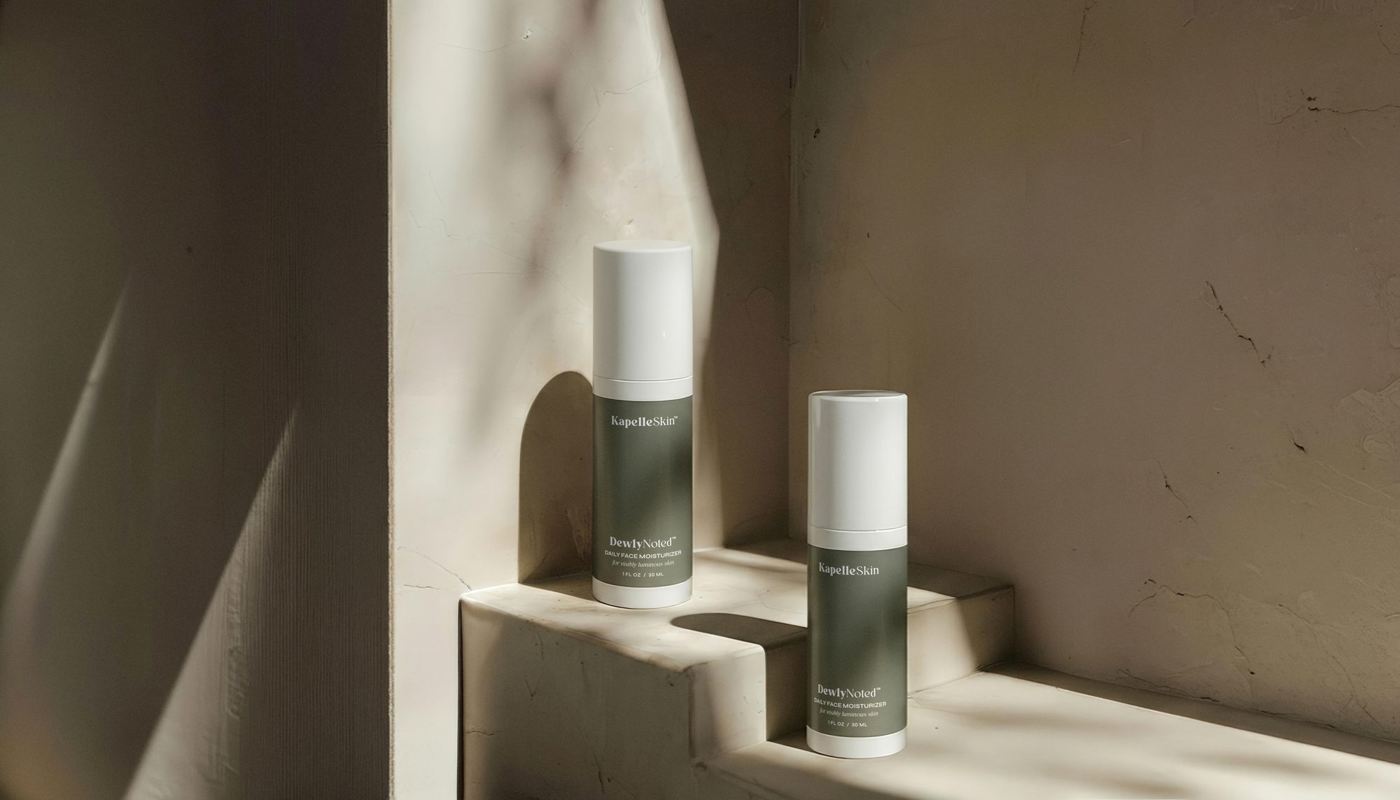 KapelleSkin bottles arranged in a sunlit, limestone-toned interior.