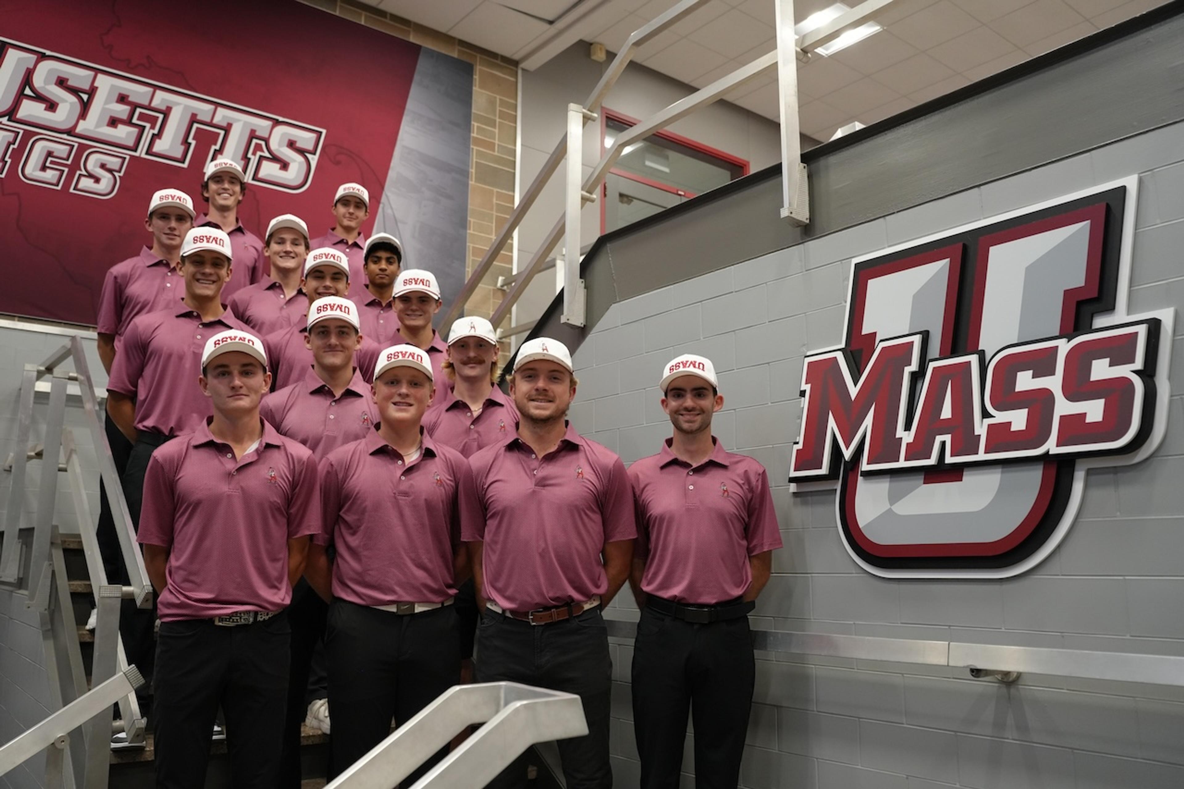 The UMass Club Golf team on the stairs of the athletics building