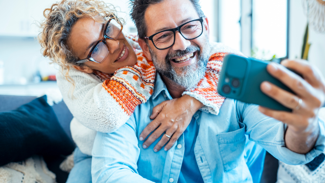Midlife adults sharing a quiet moment together, representing sexual health and well-being over time.