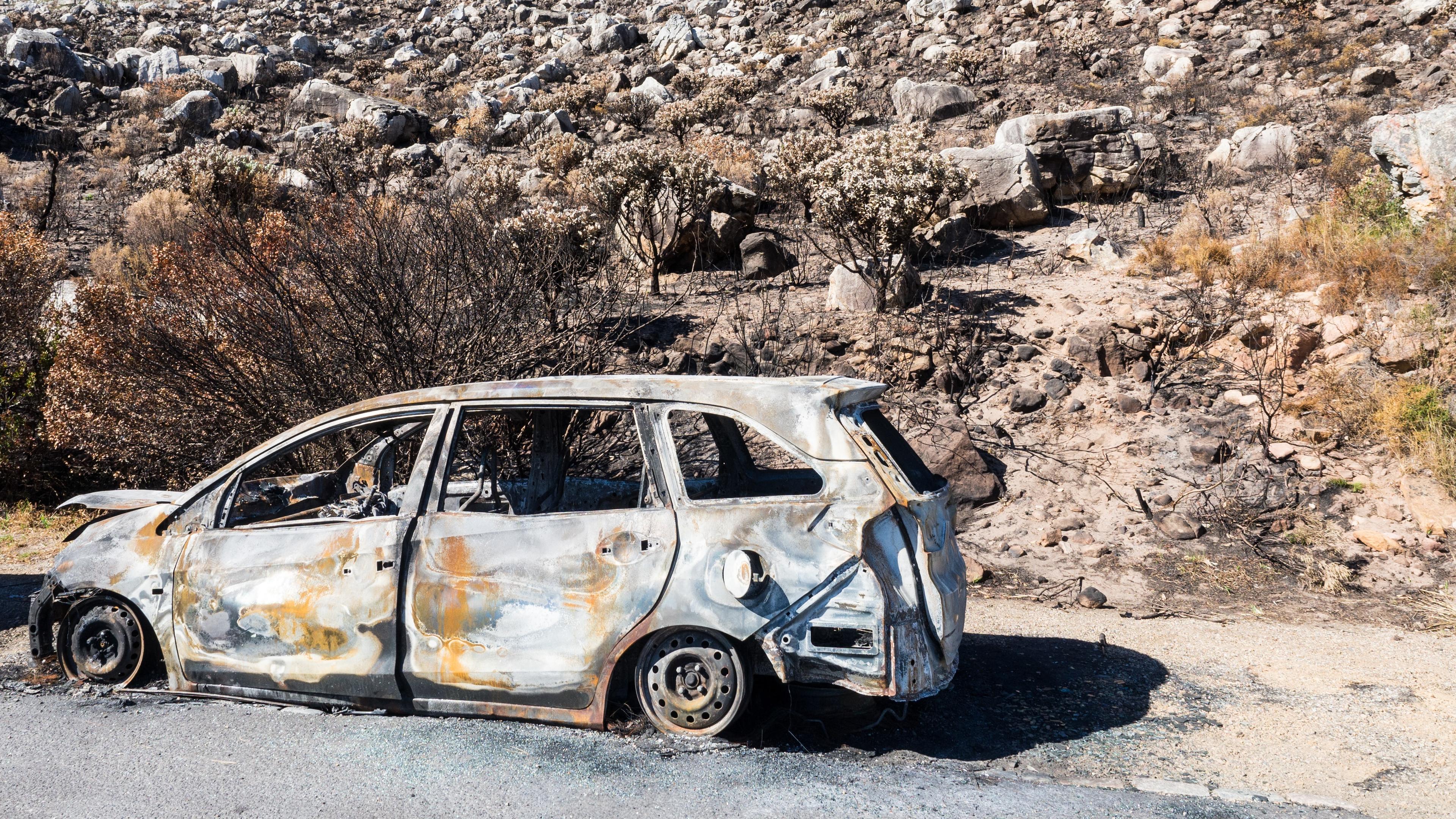 burned out car in the desert
