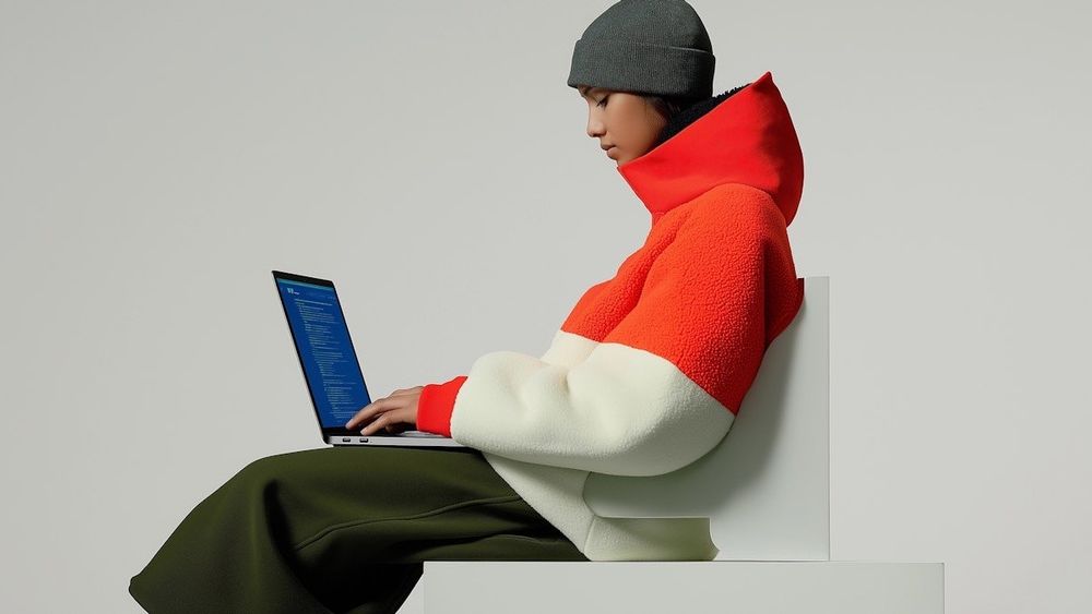 Woman on a laptop coding 