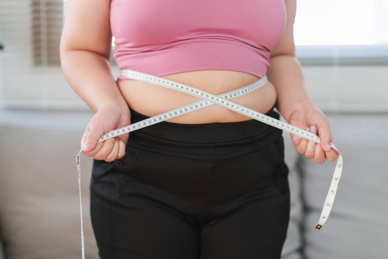 Woman measuring waist