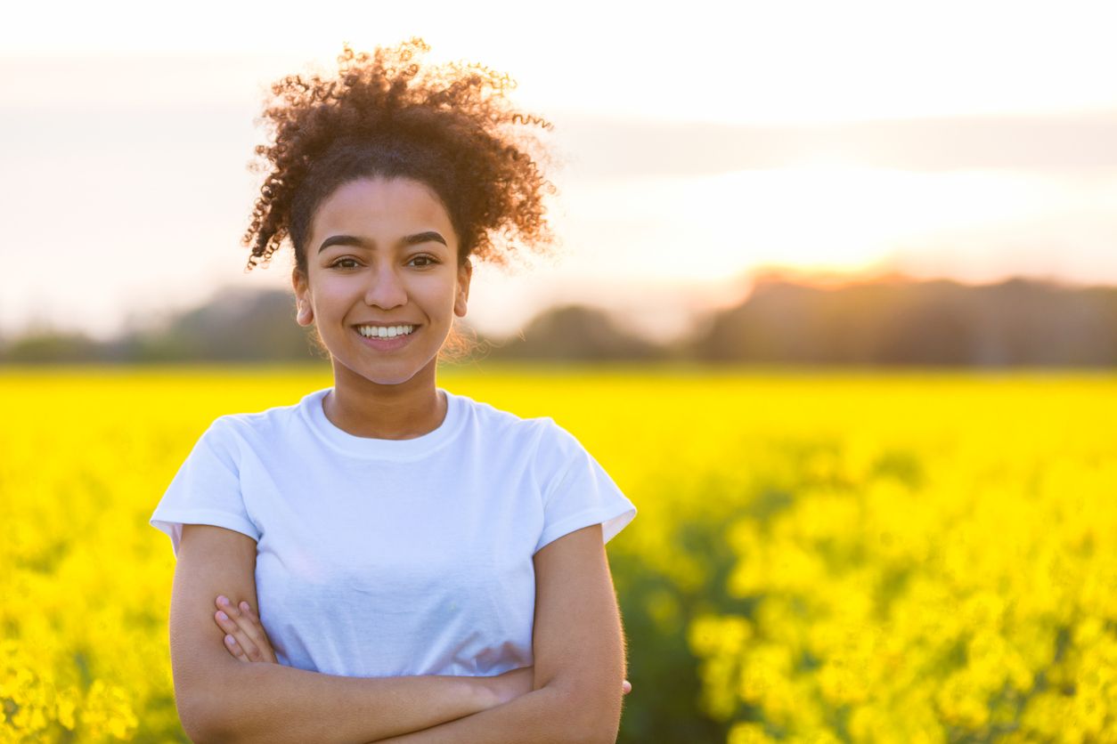 Woman standing in springtime field