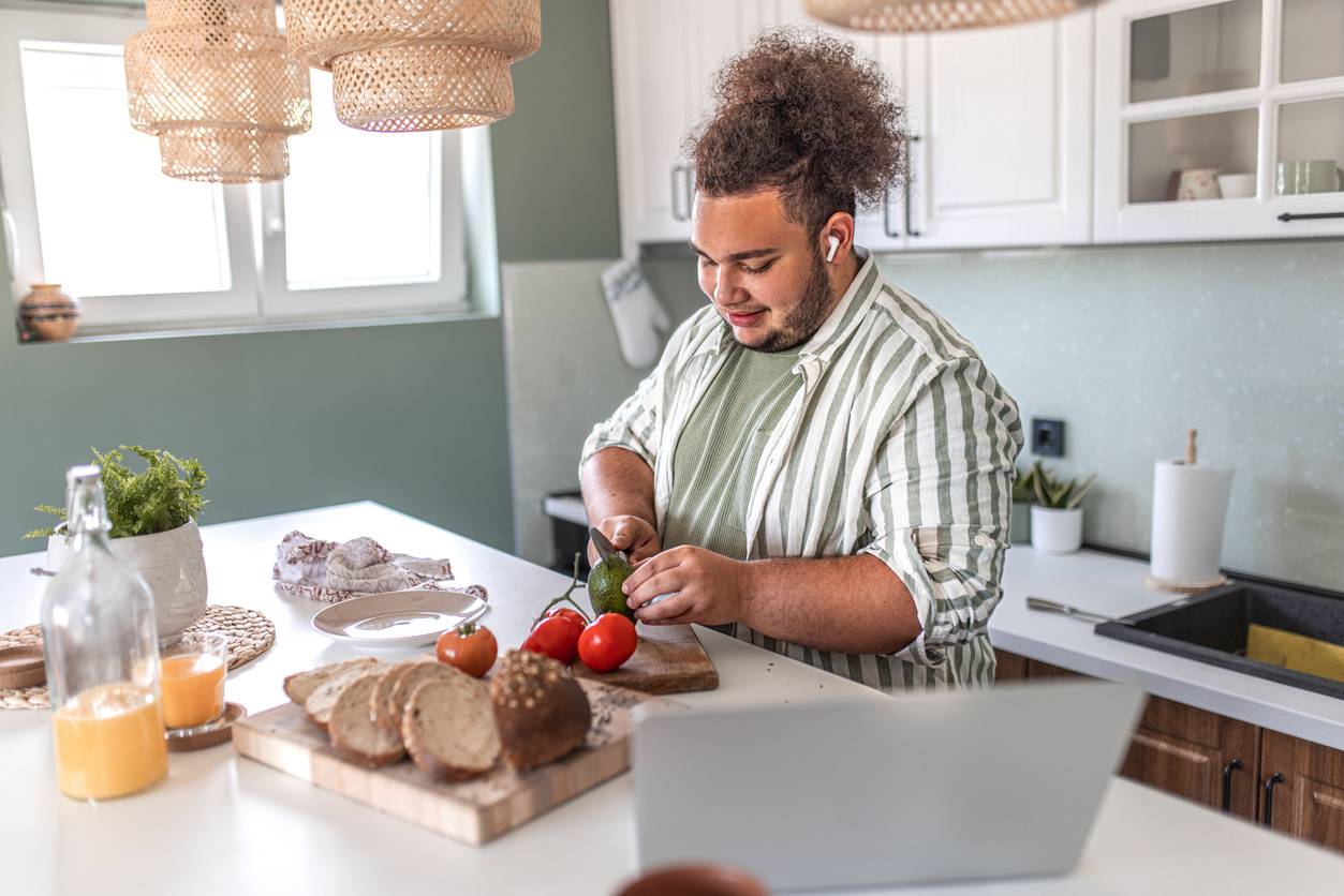 Overweight man cooking