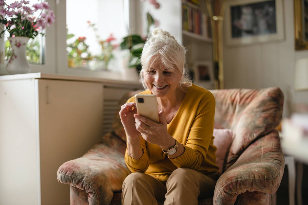 Mature woman using her phone