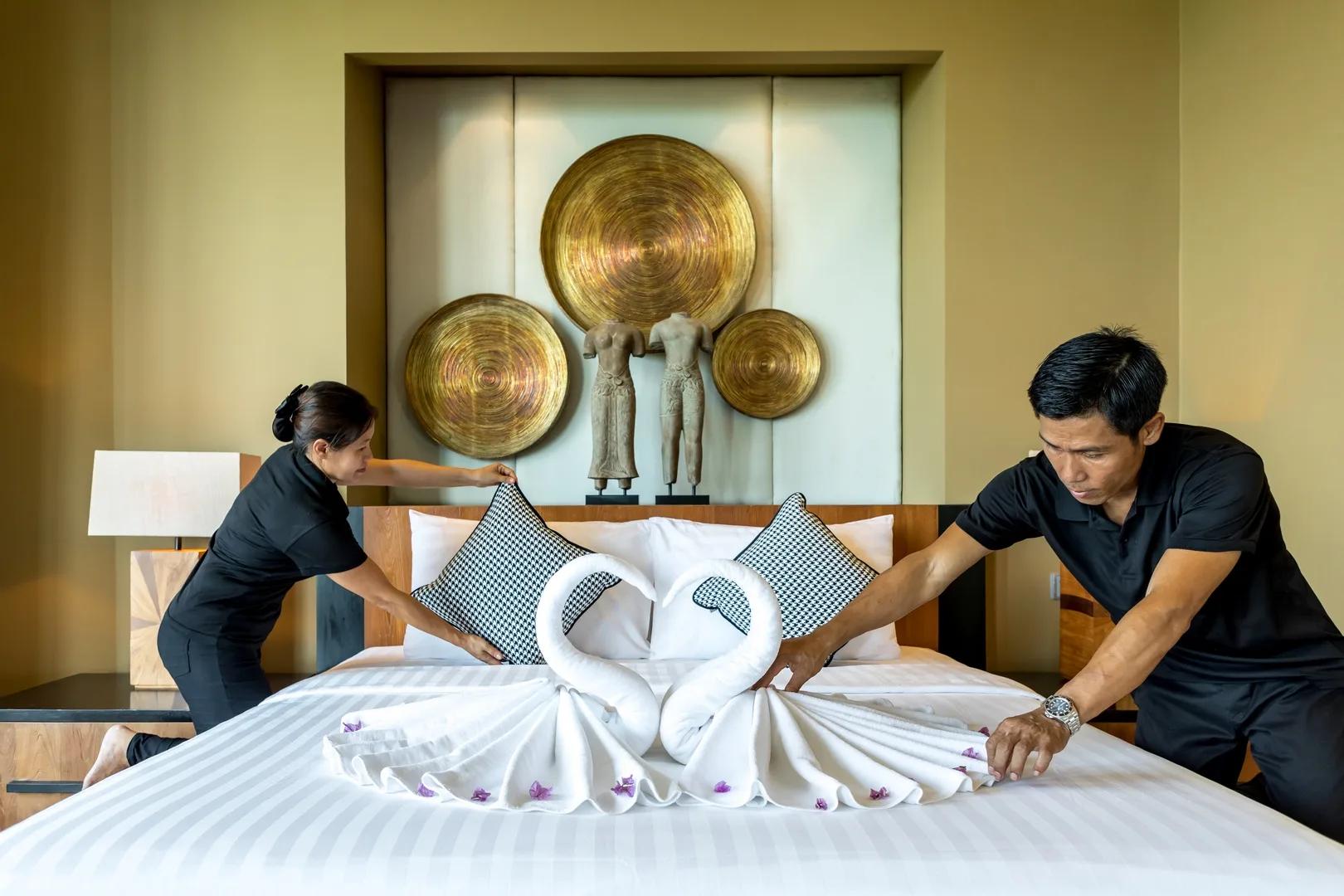 Villa Skyfall team preparing a guest bedroom