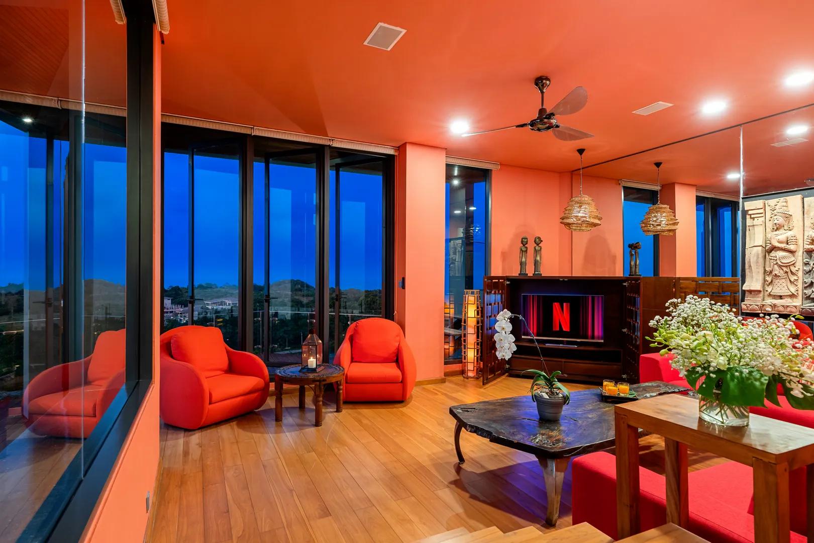 Red lounge at Villa Skyfall in the evening