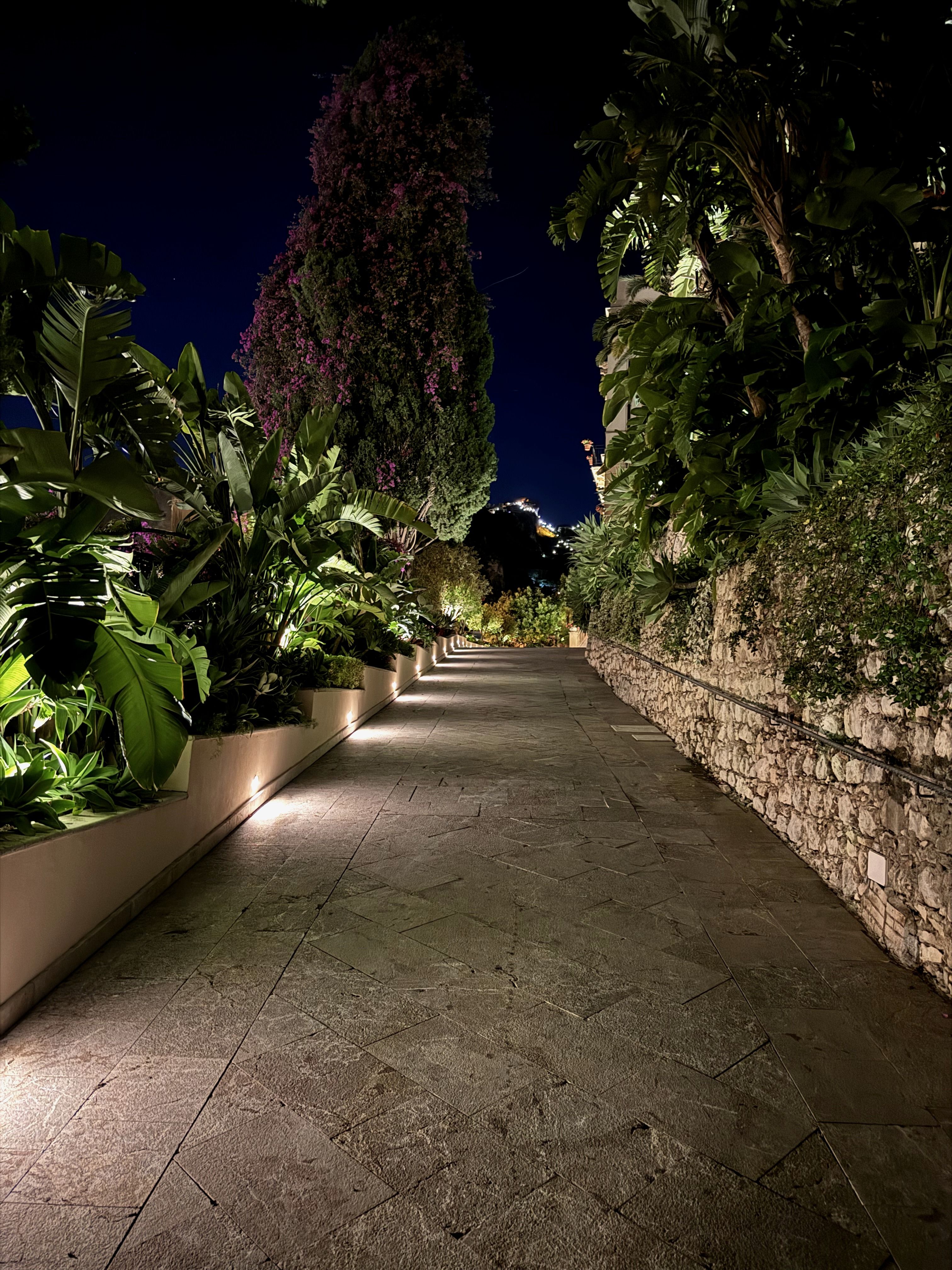 Upscale private estate walkway at night