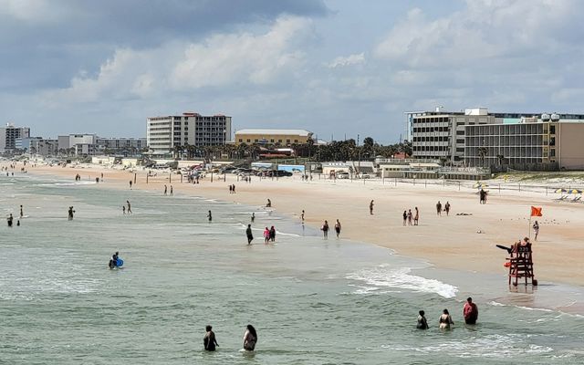 a group of people on a beach