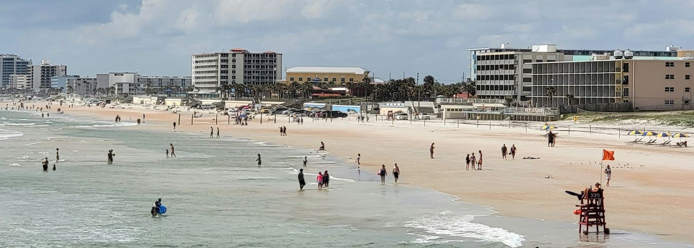 a group of people on a beach