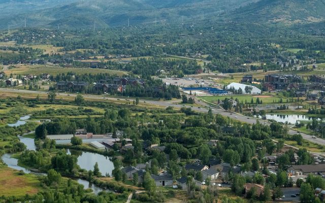 an aerial view of a town surrounded by mountains