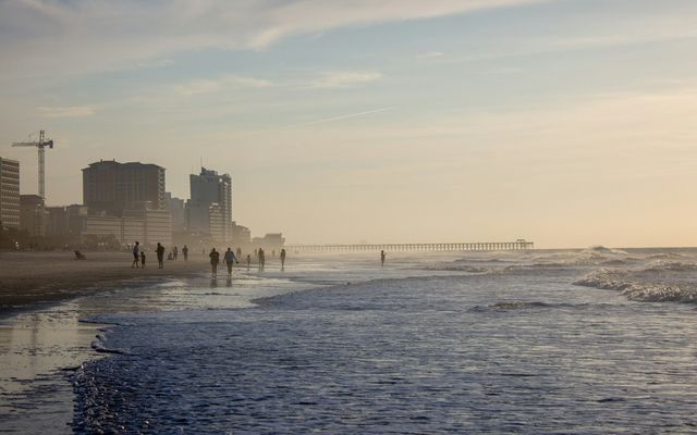 city skyline across the sea during daytime