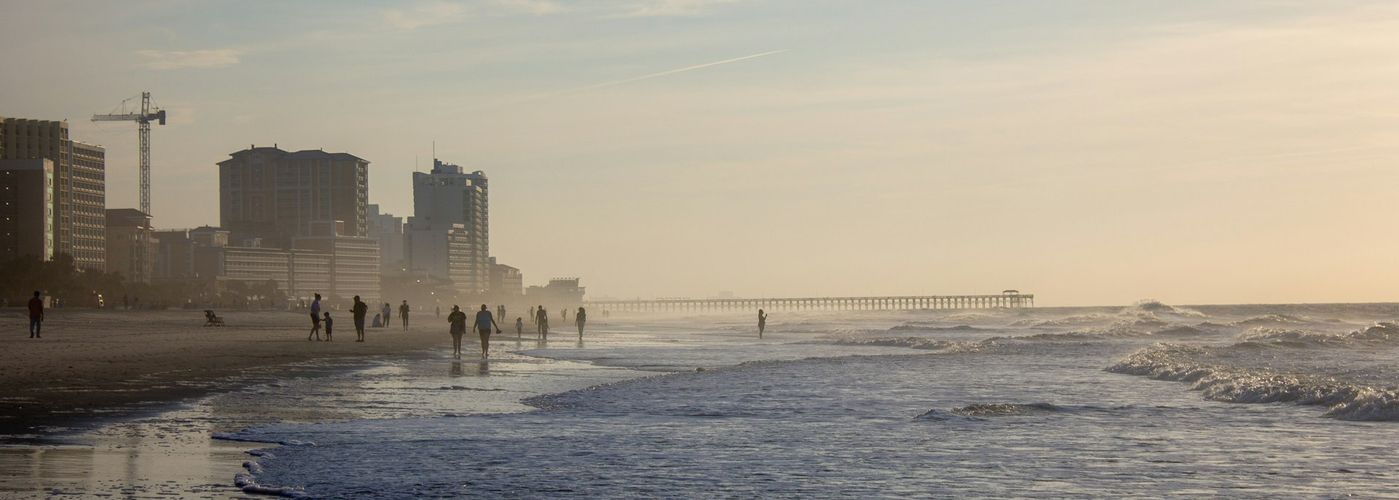 city skyline across the sea during daytime