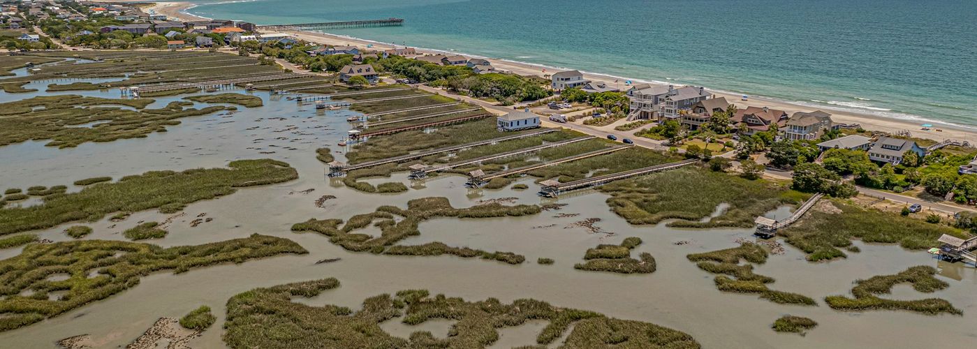 An aerial view of a beach and a body of water