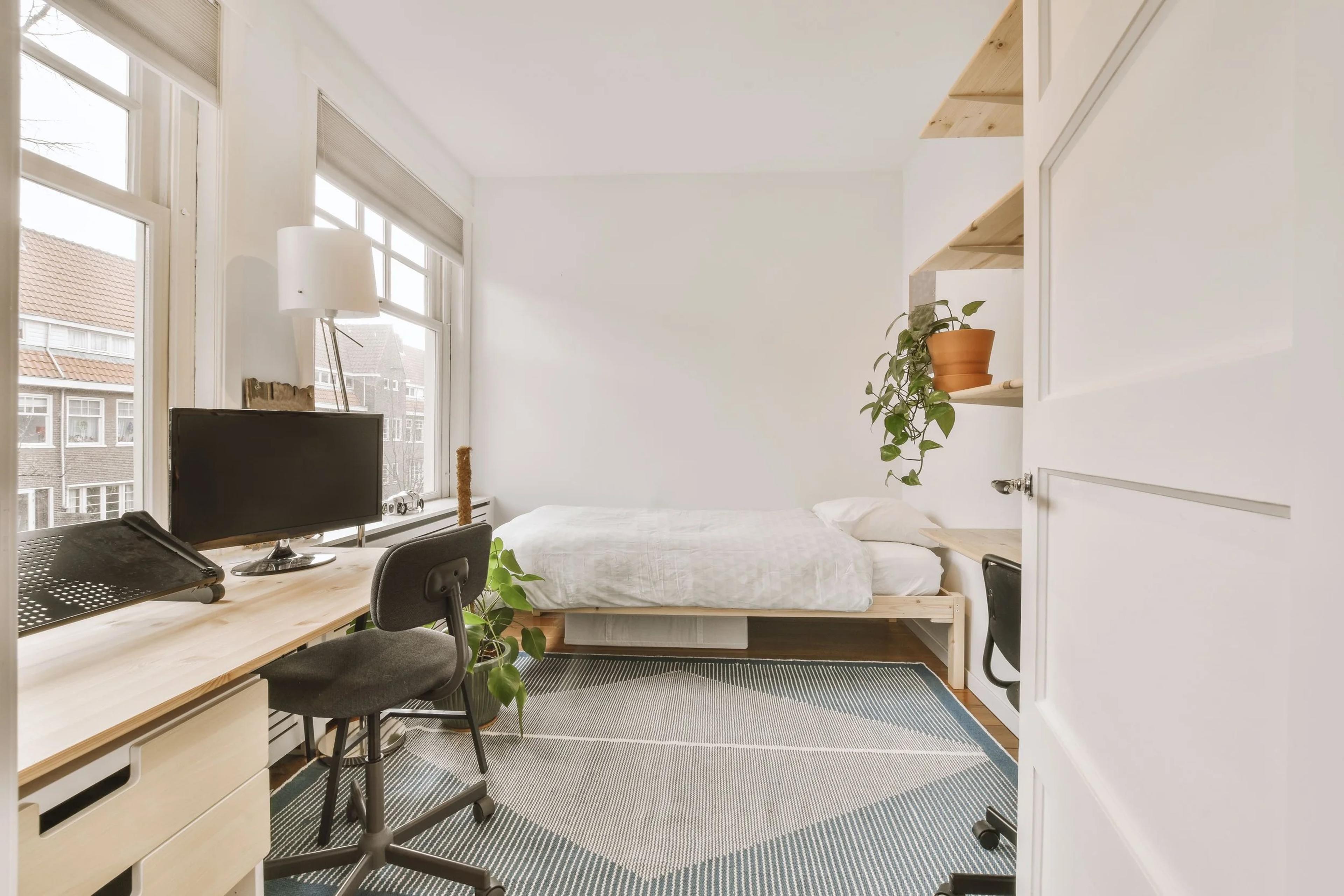 Small bedroom set up with a desk and single bed, ready to rent out