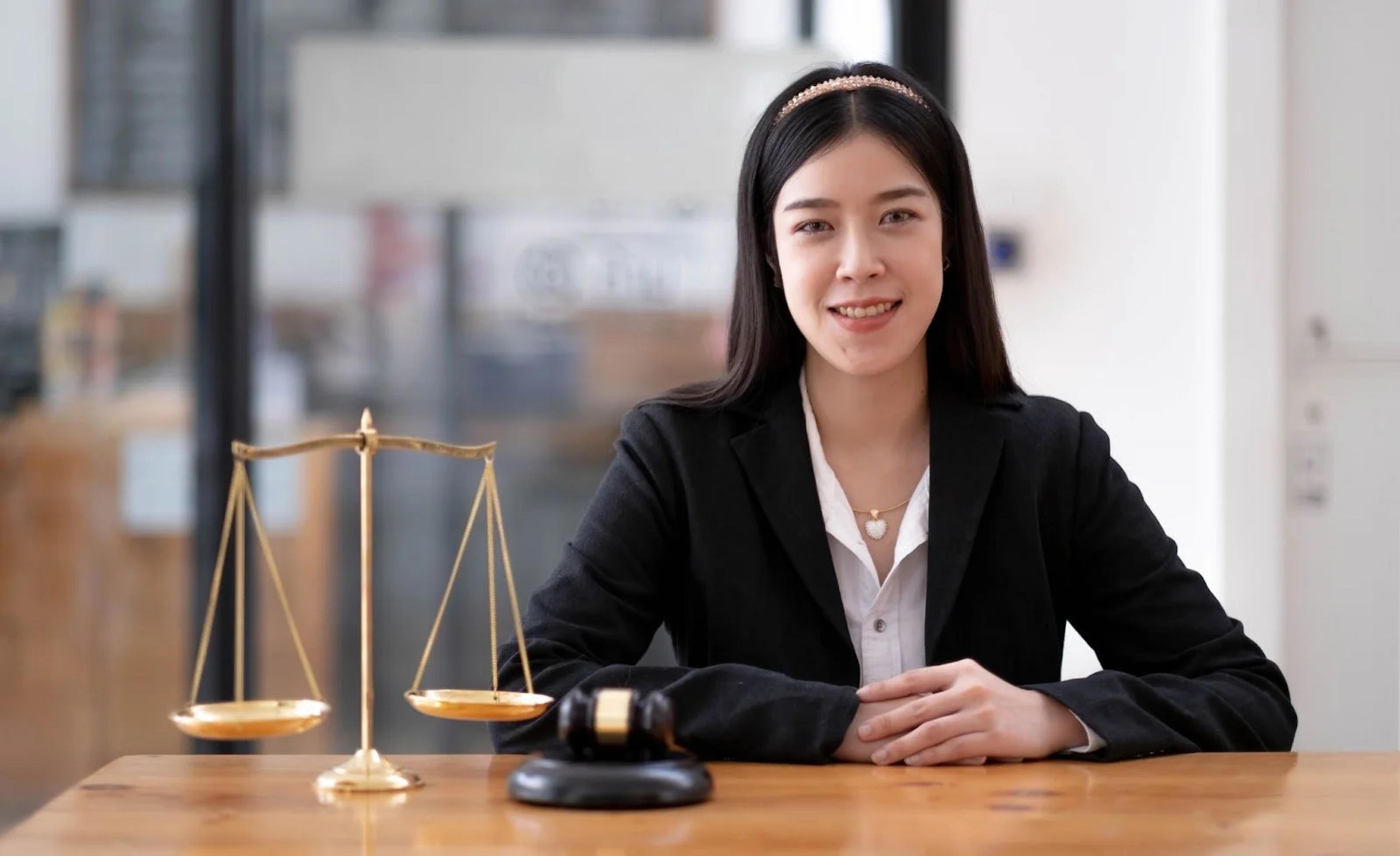 Lawyer at a desk with the scales of justice, handling property conveyancing