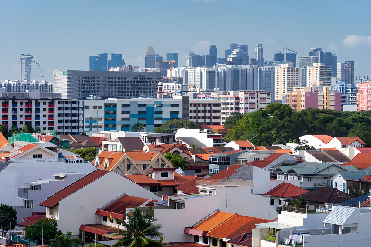 Singapore skyline behind landed homes and low-rise apartment blocks