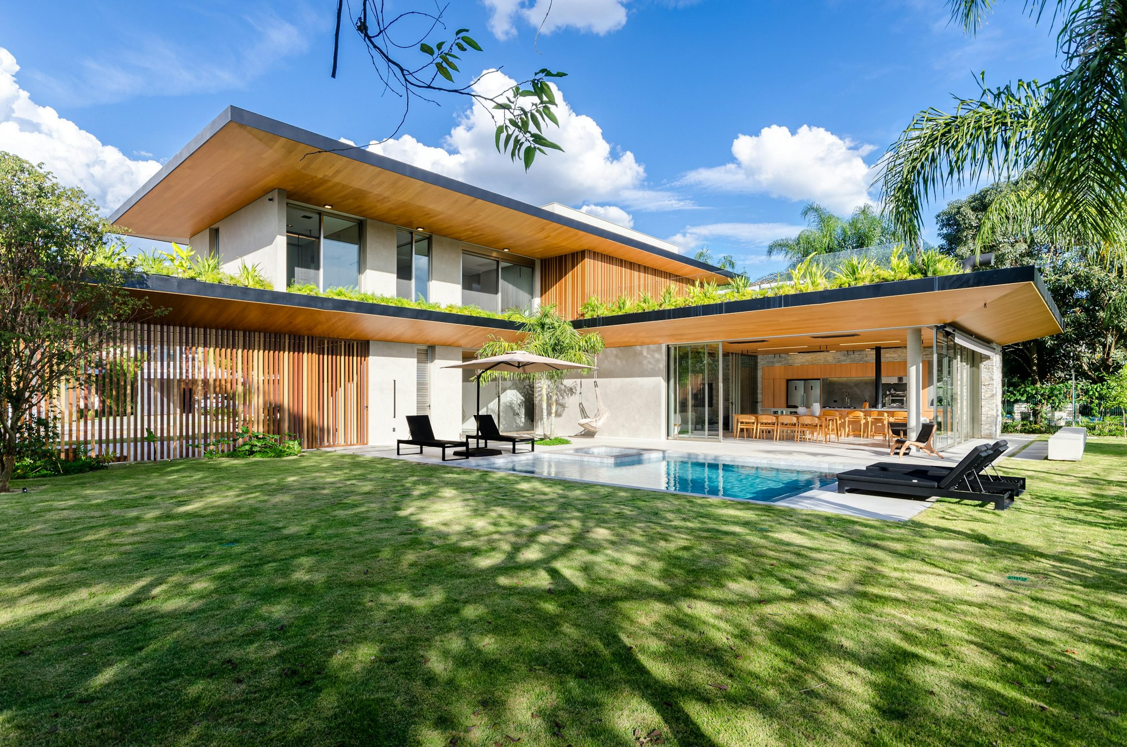 A modern landed home with a garden and pool