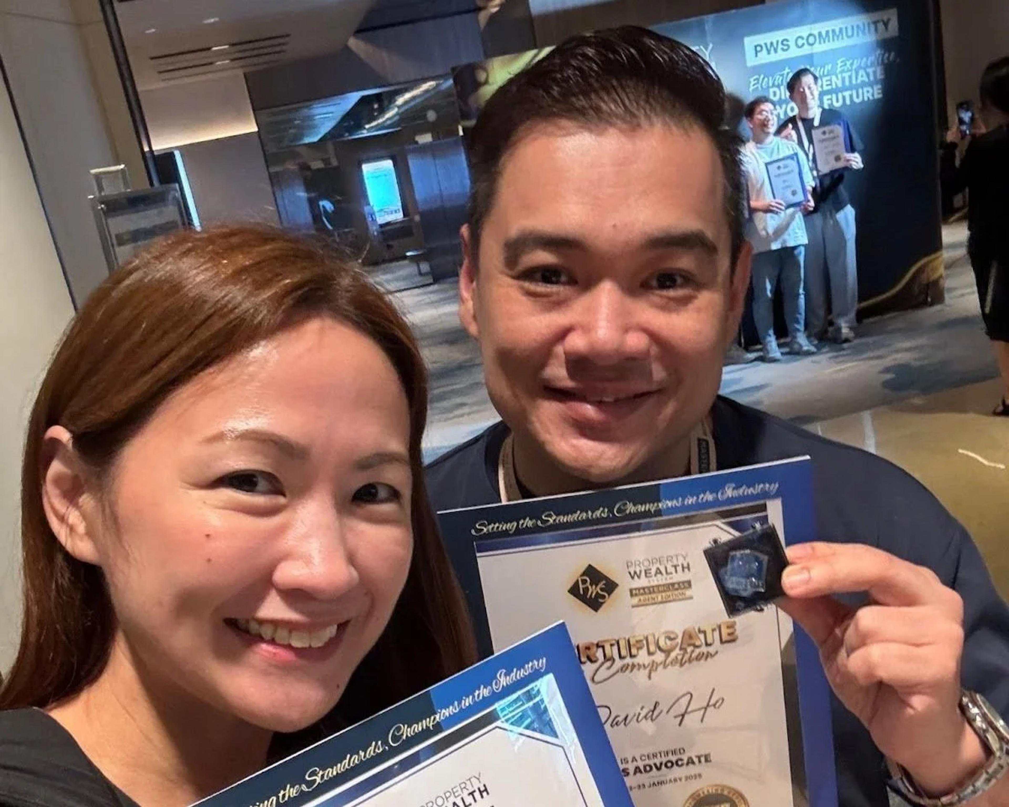 David Ho and Audrie Poh holding their course completion certificates