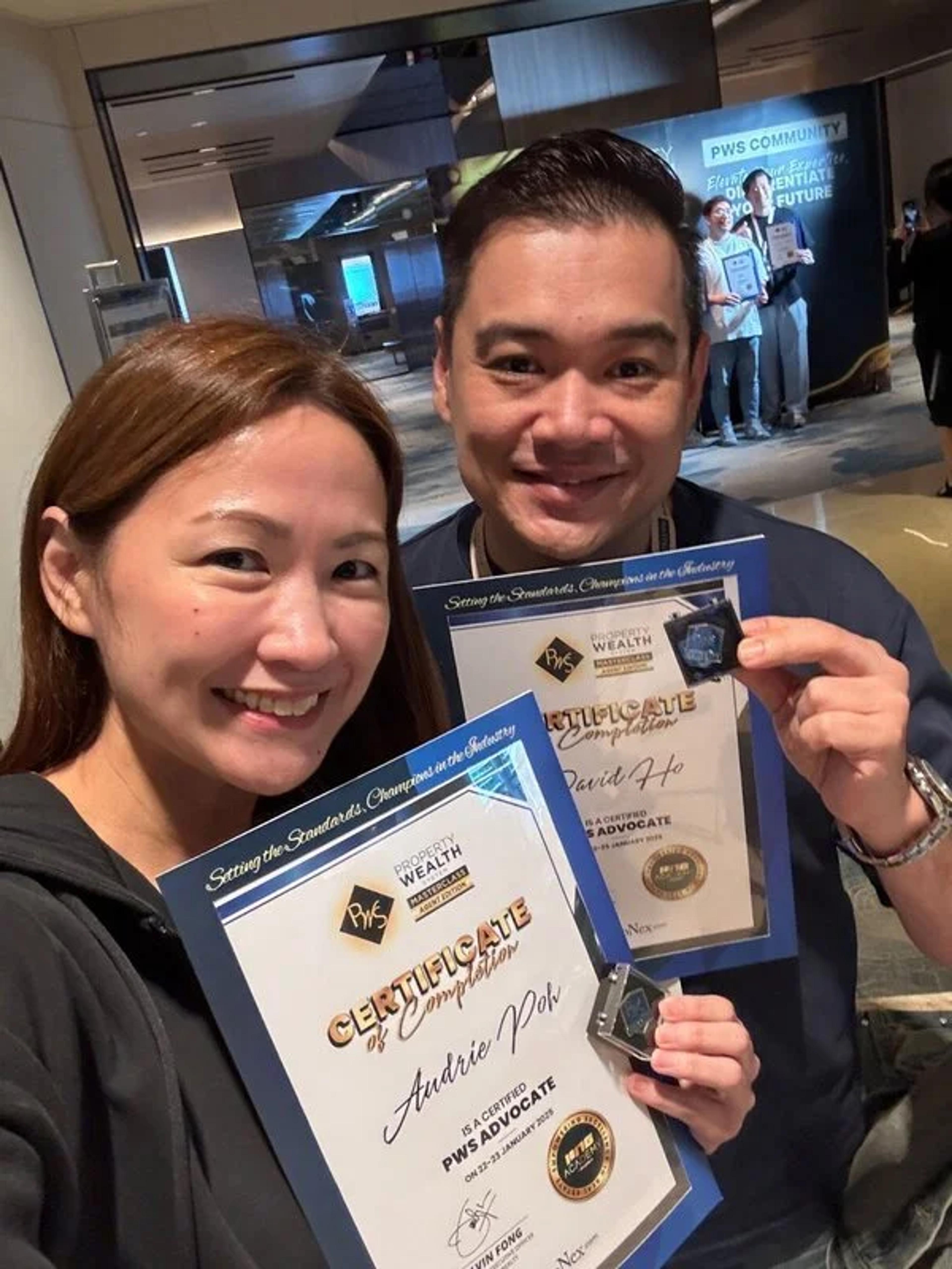 David Ho and Audrie Poh with their certificates of completion