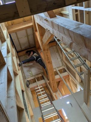 On-going work shot looking up at the inner rafters of the house.