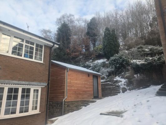 Rearview of the studio extension in the snow.