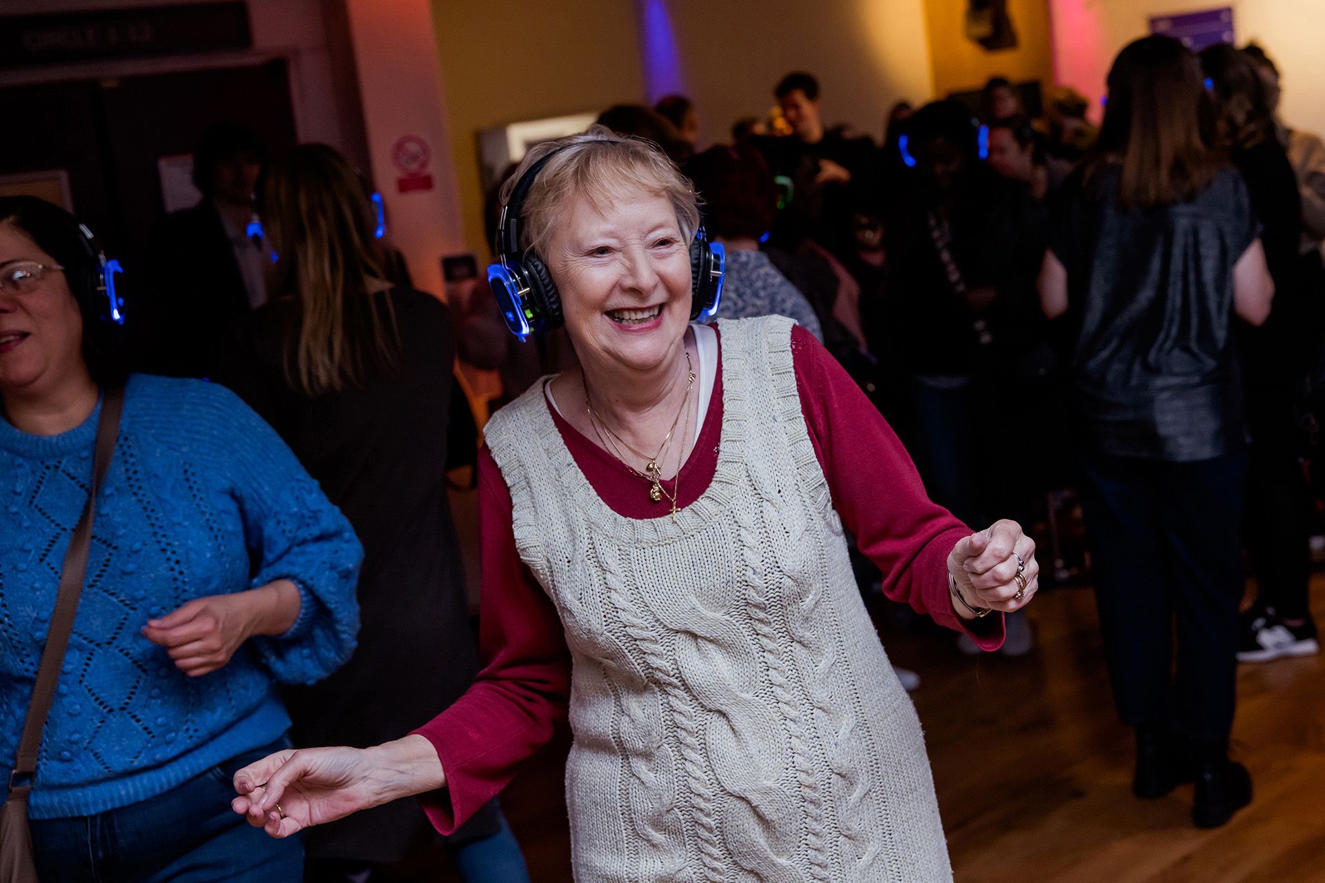 A dancer with headphones on at a silent disco.