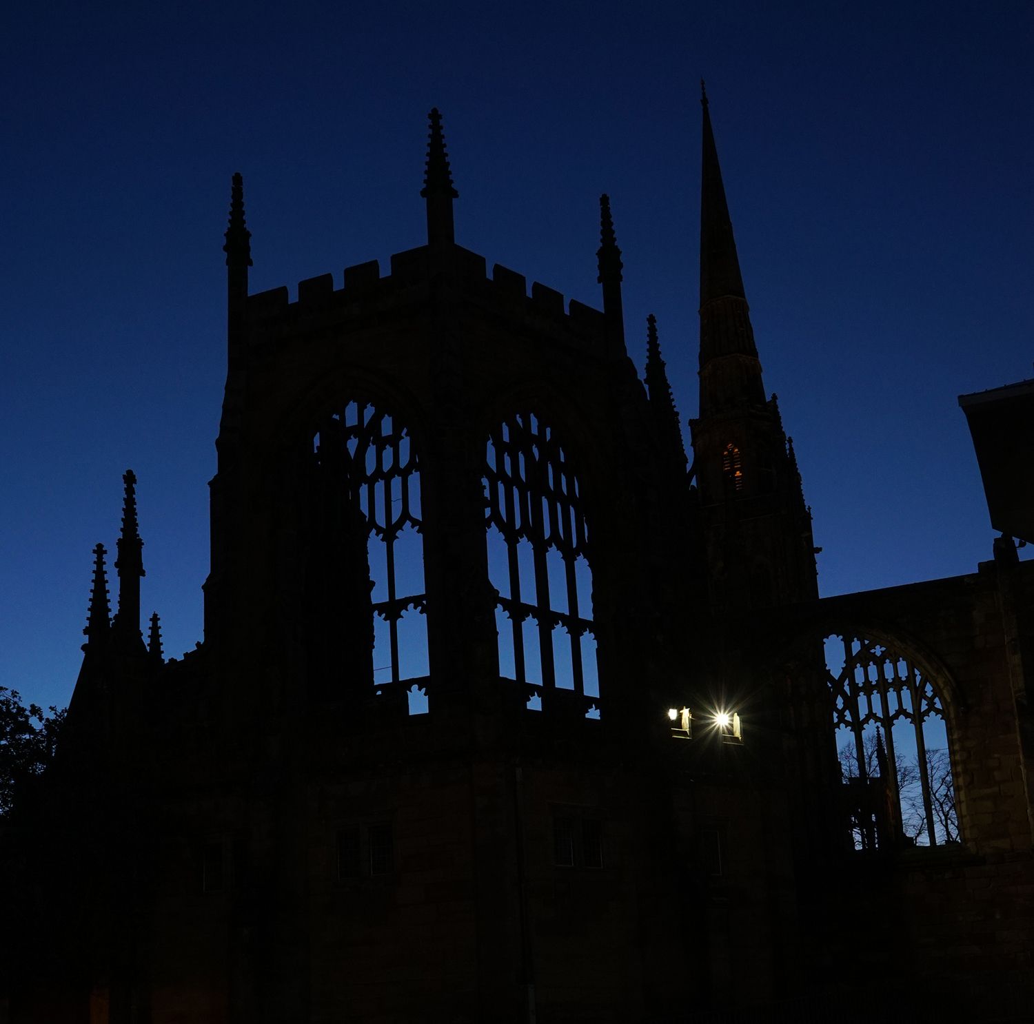 Photograph of Coventry Cathedral at night.