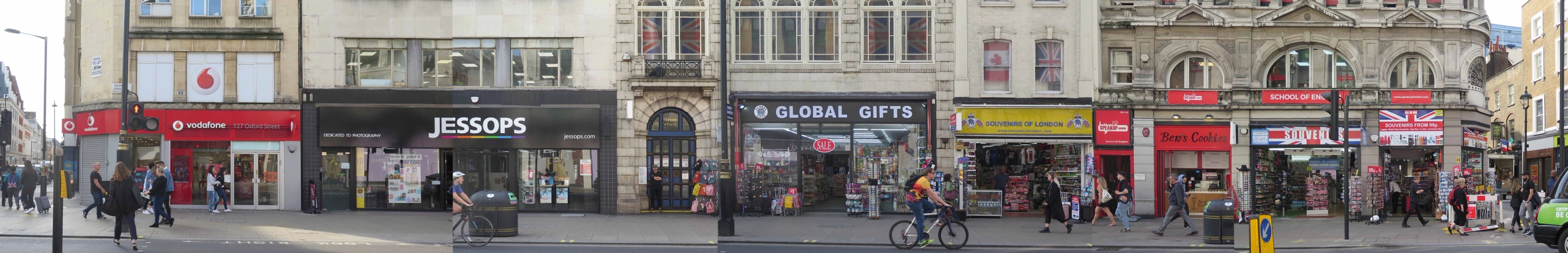 Panoramic photo of a strip of oxford street with a number of shops